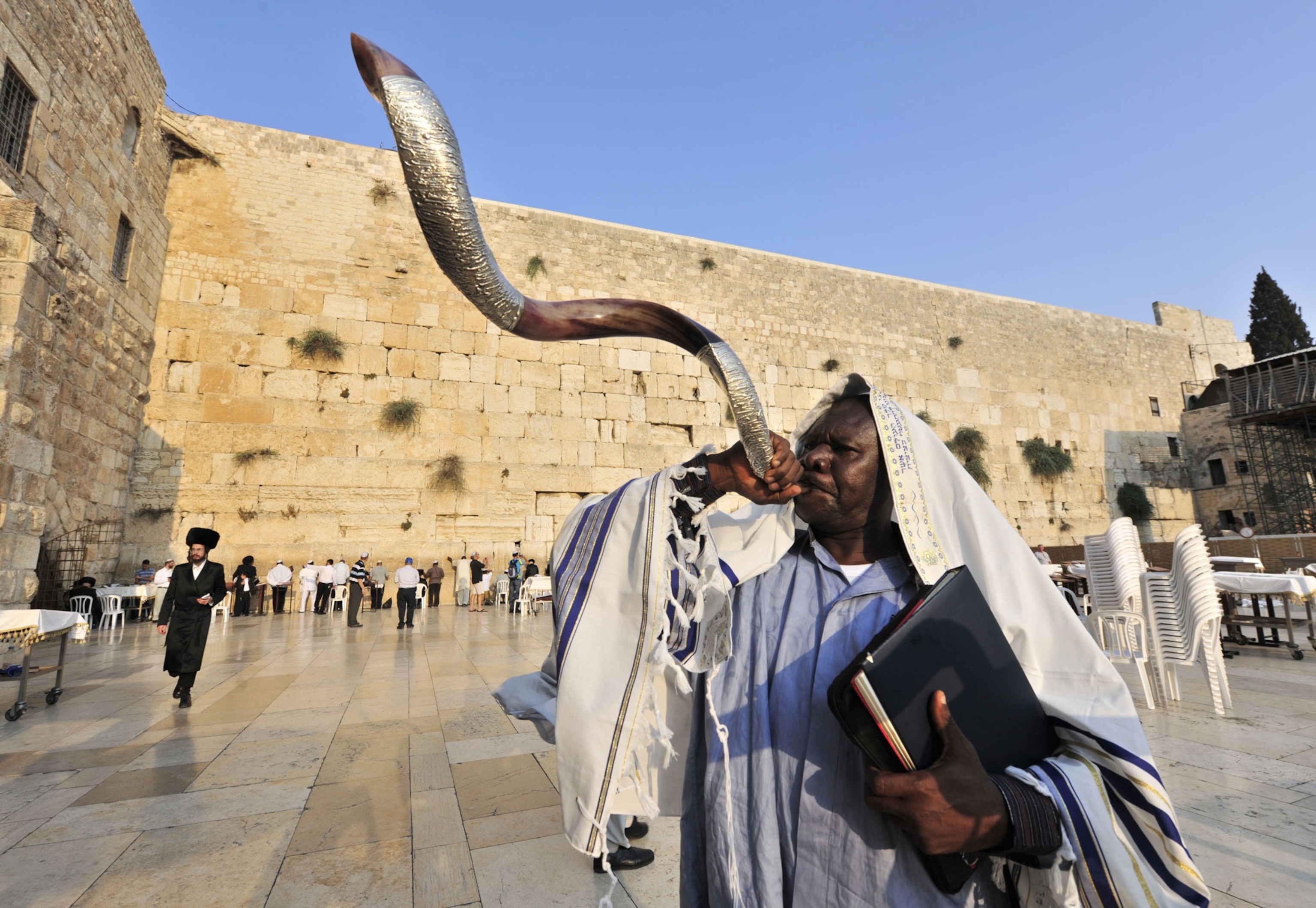 A man blows a horn in Jerusalem