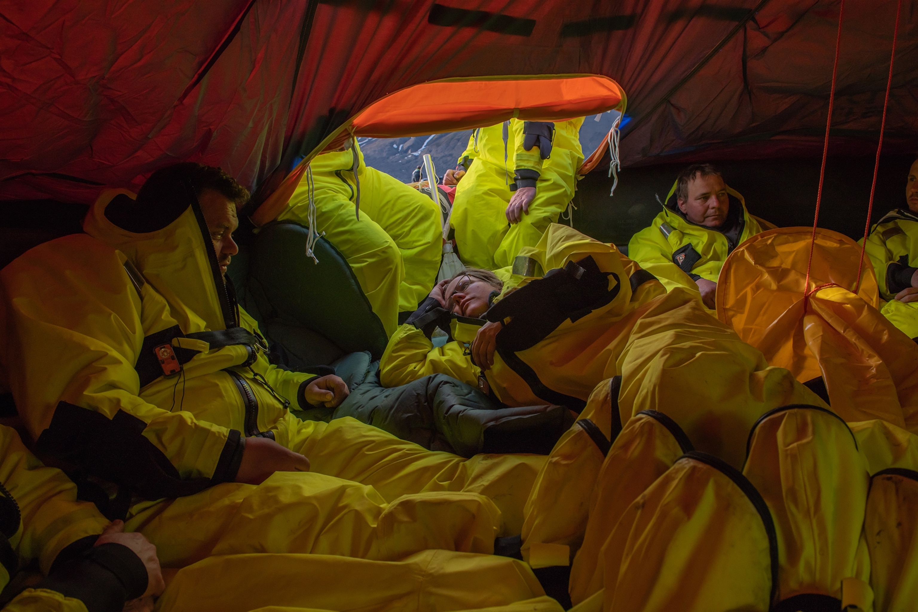 survival training participants in a liferaft