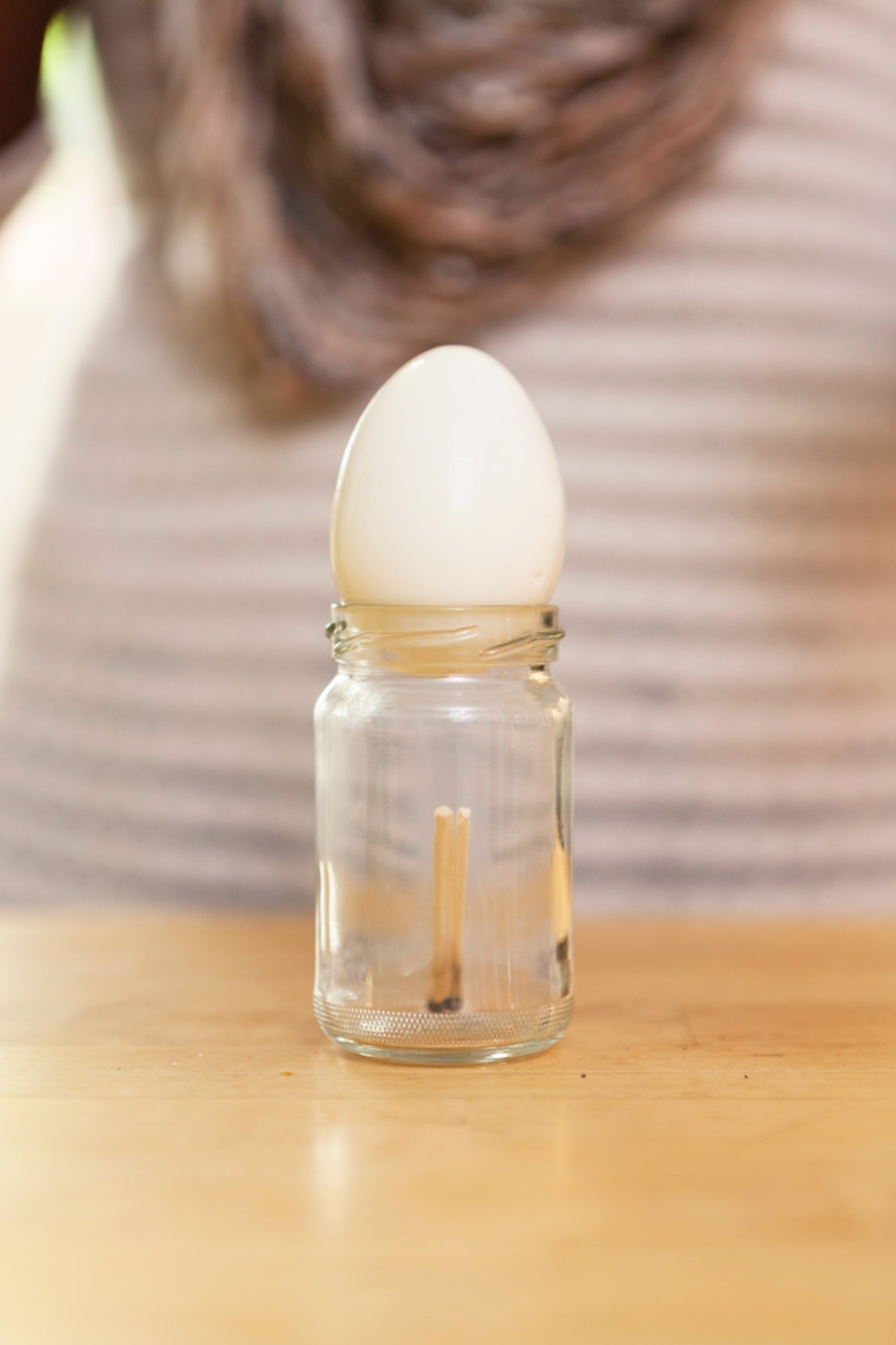 Hard-boiled egg and a jar with matches.