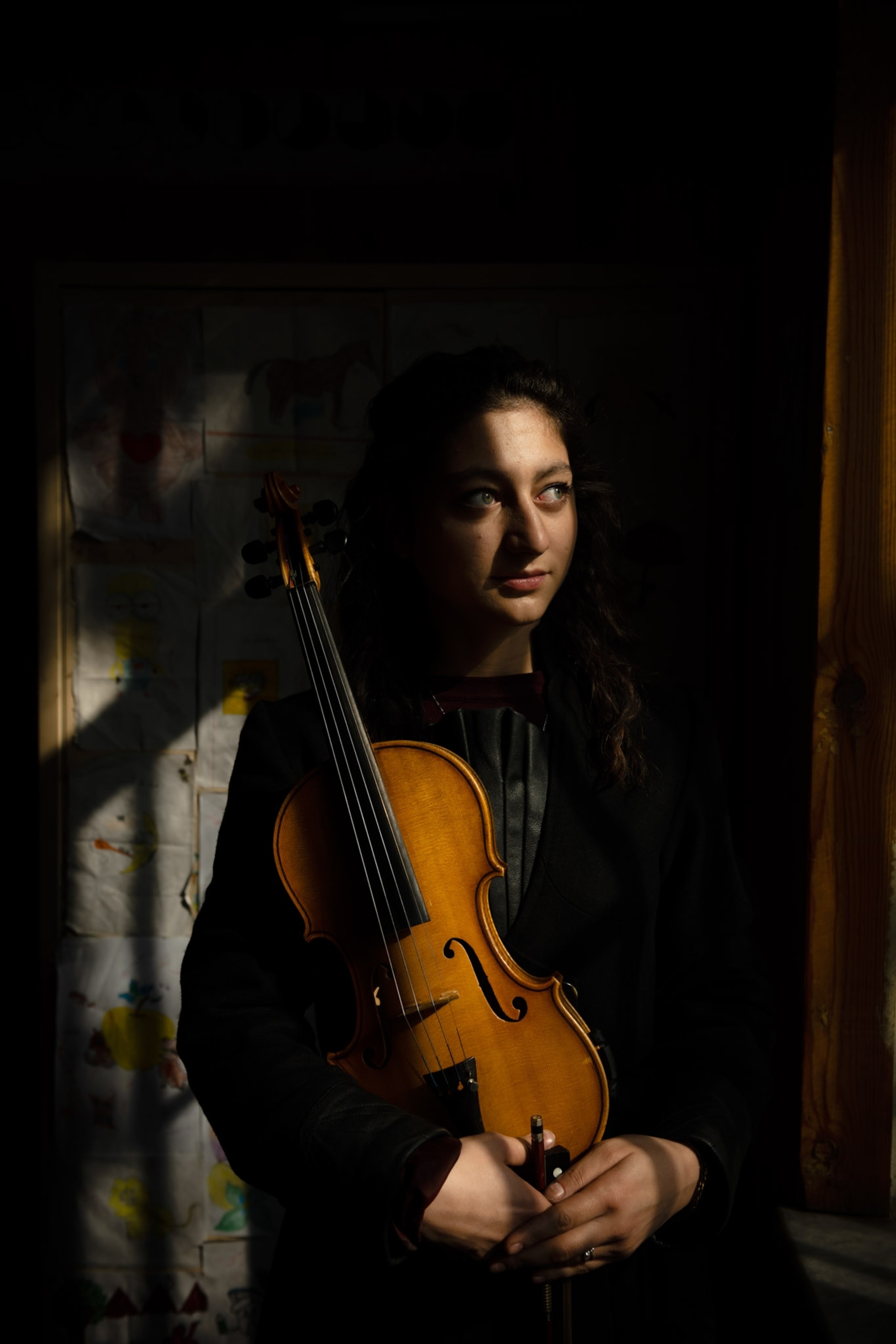 Picture of a woman holding her violin