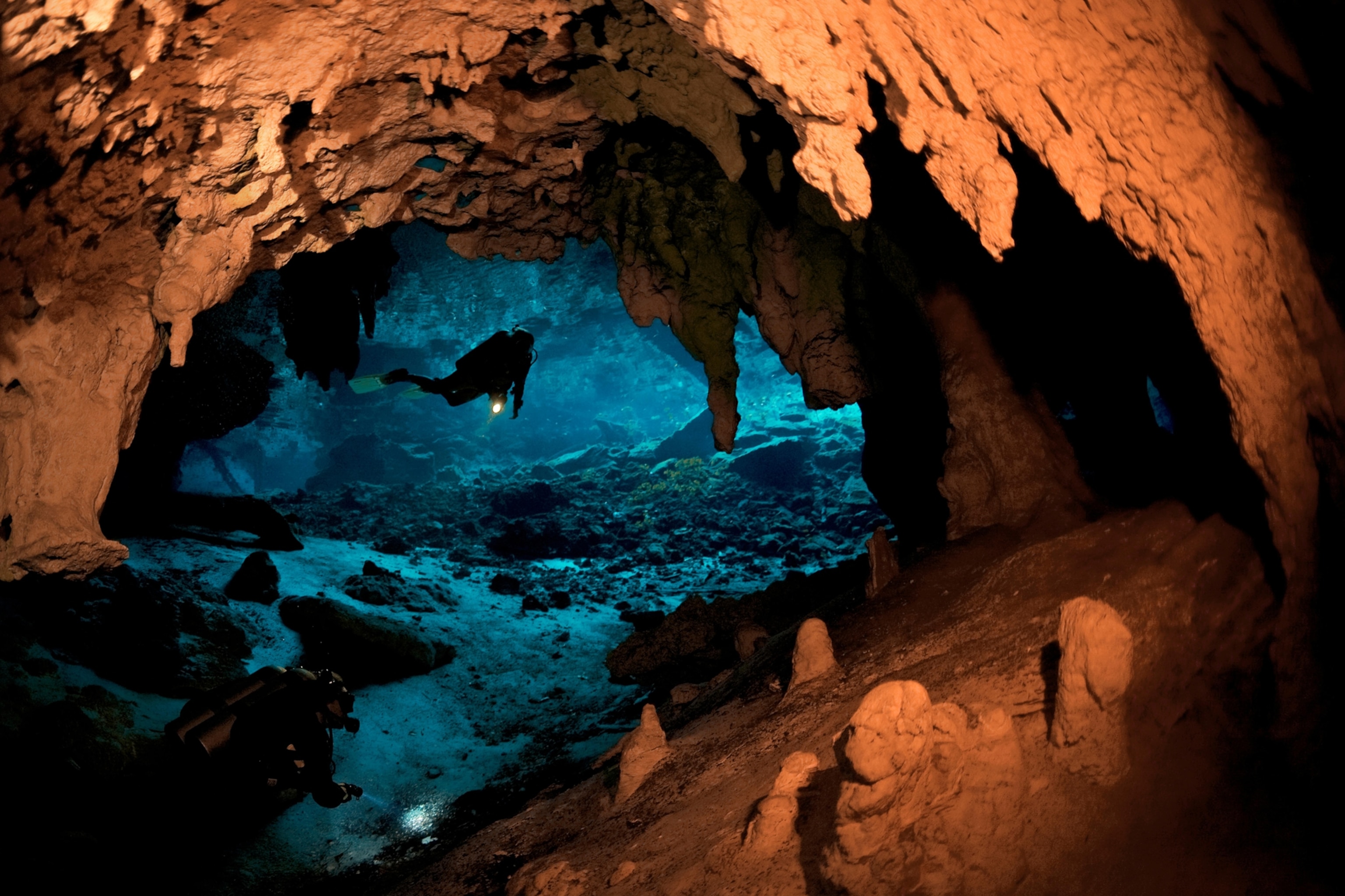 a cave diver inside the cenote Grand Cenote, Yucatan, Quintana Roo, Mexico