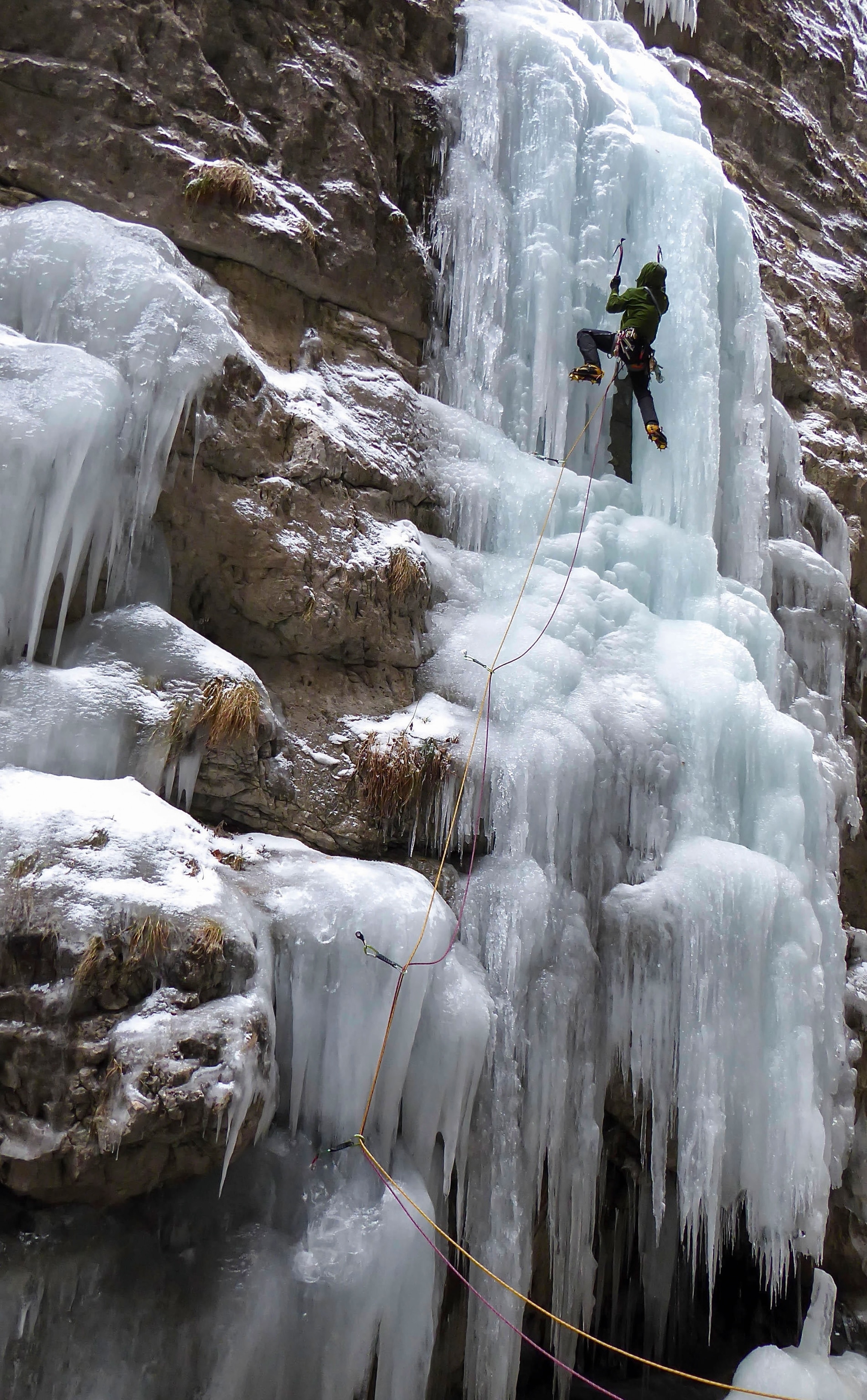 man ice climbing in Italy