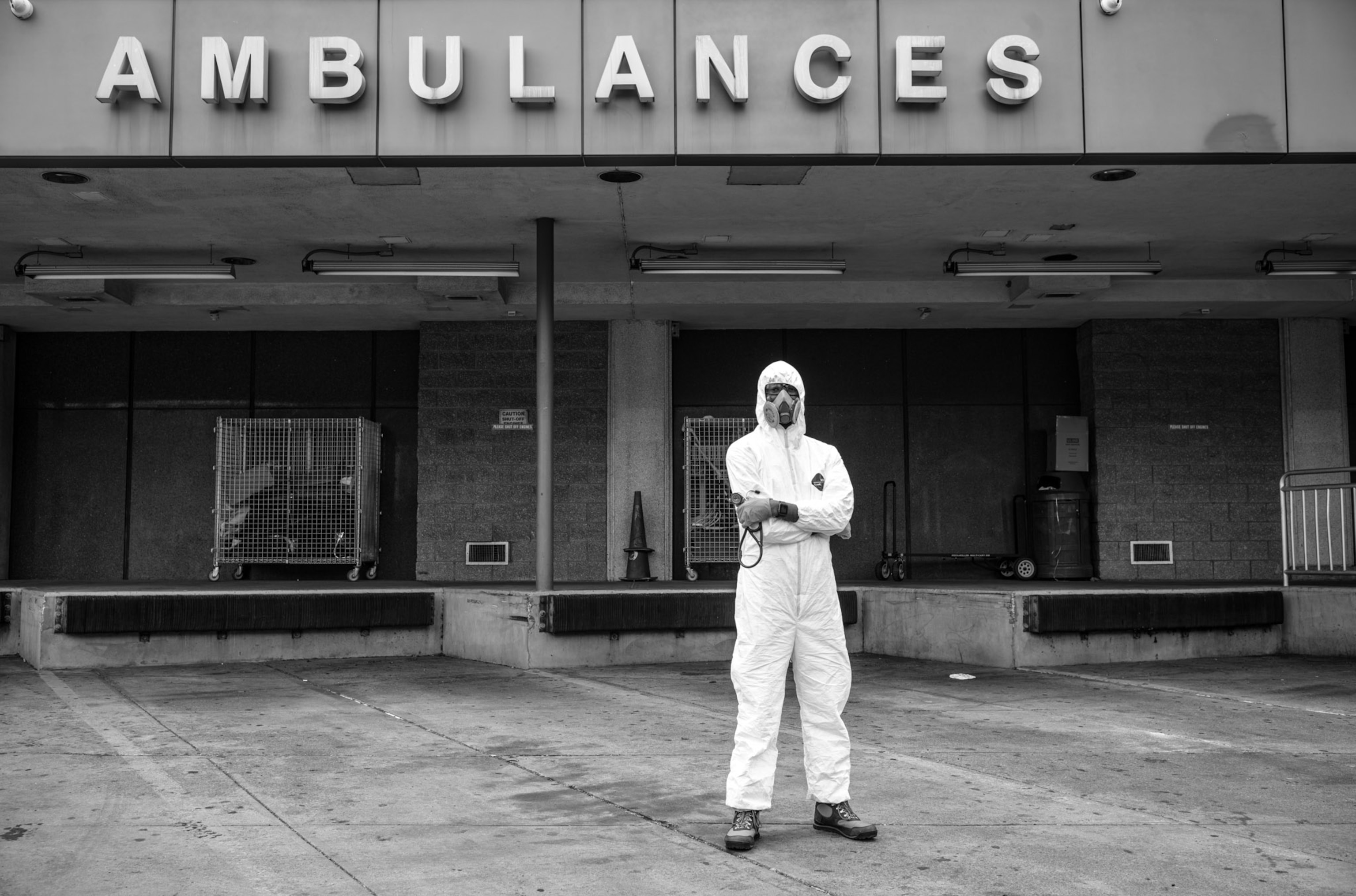 a person standing outside of an ambulance entryway