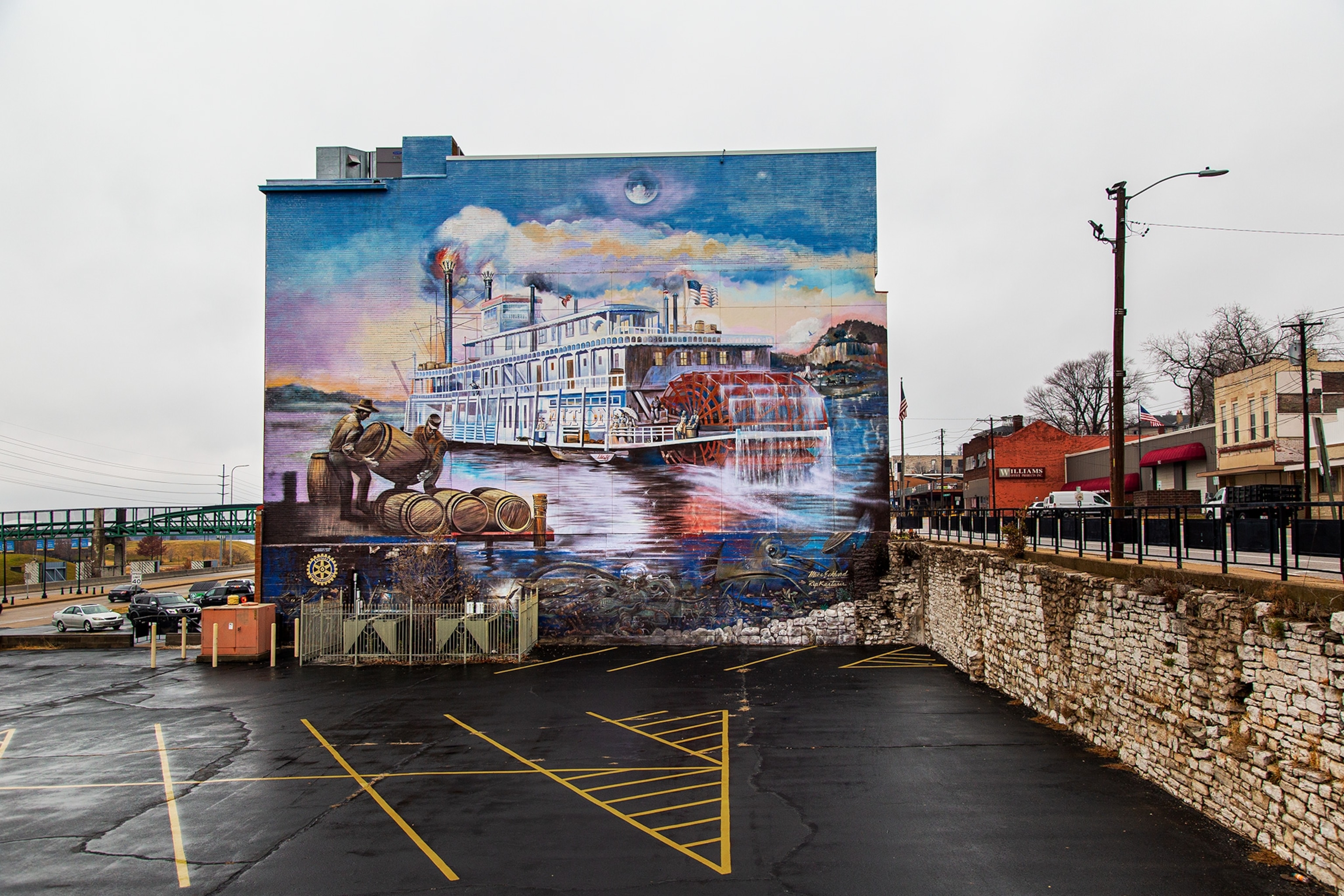 A mural of a boat on the Mississippi River in a parking lot in Alton, Illinois.