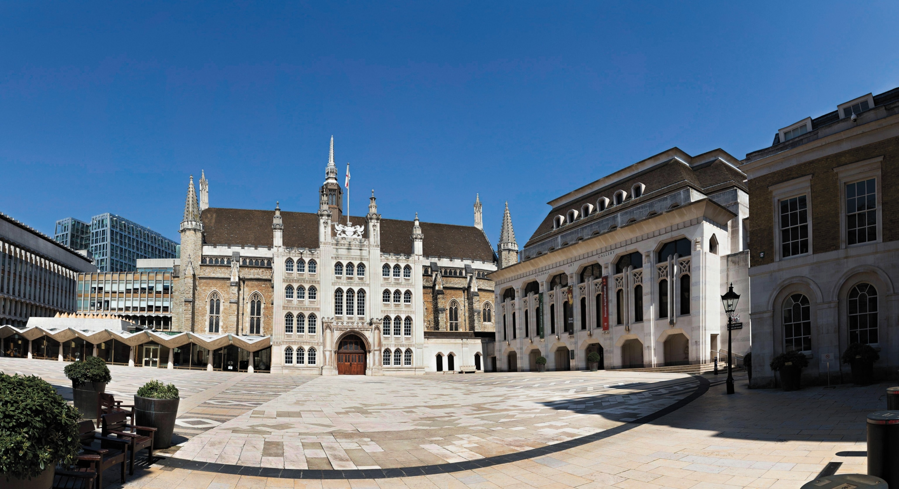 Photo of large white ornate building against blue sky