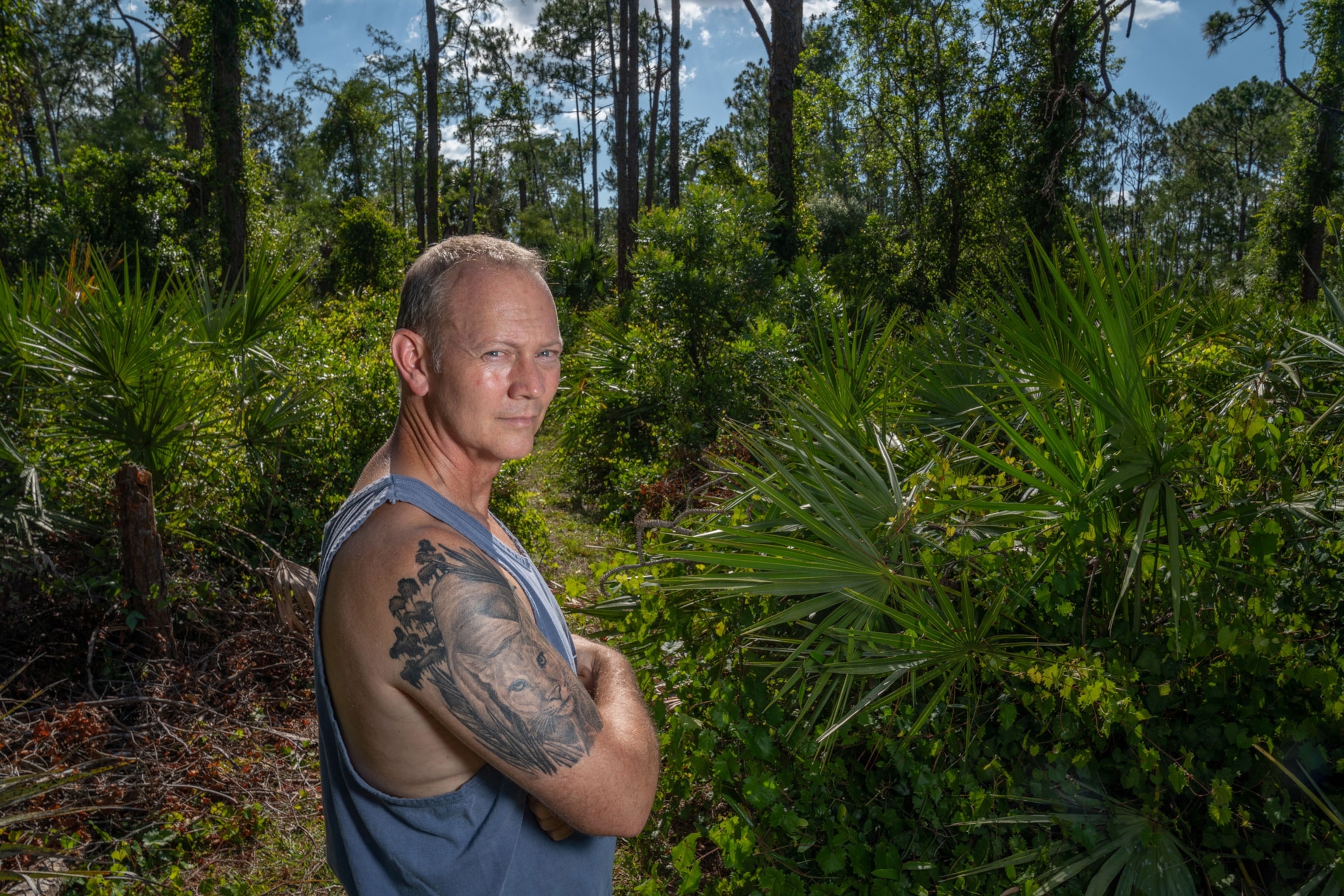 a man with a panther tattoo
