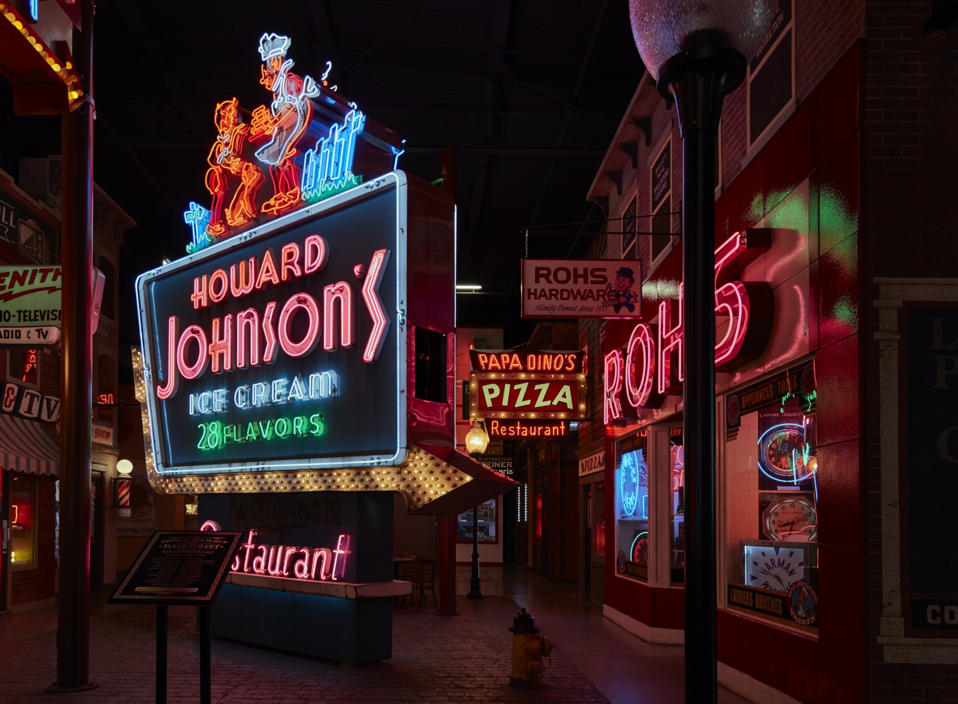 A classic outdoor neon Howard Johnson's sign displayed at the American Sign Museum