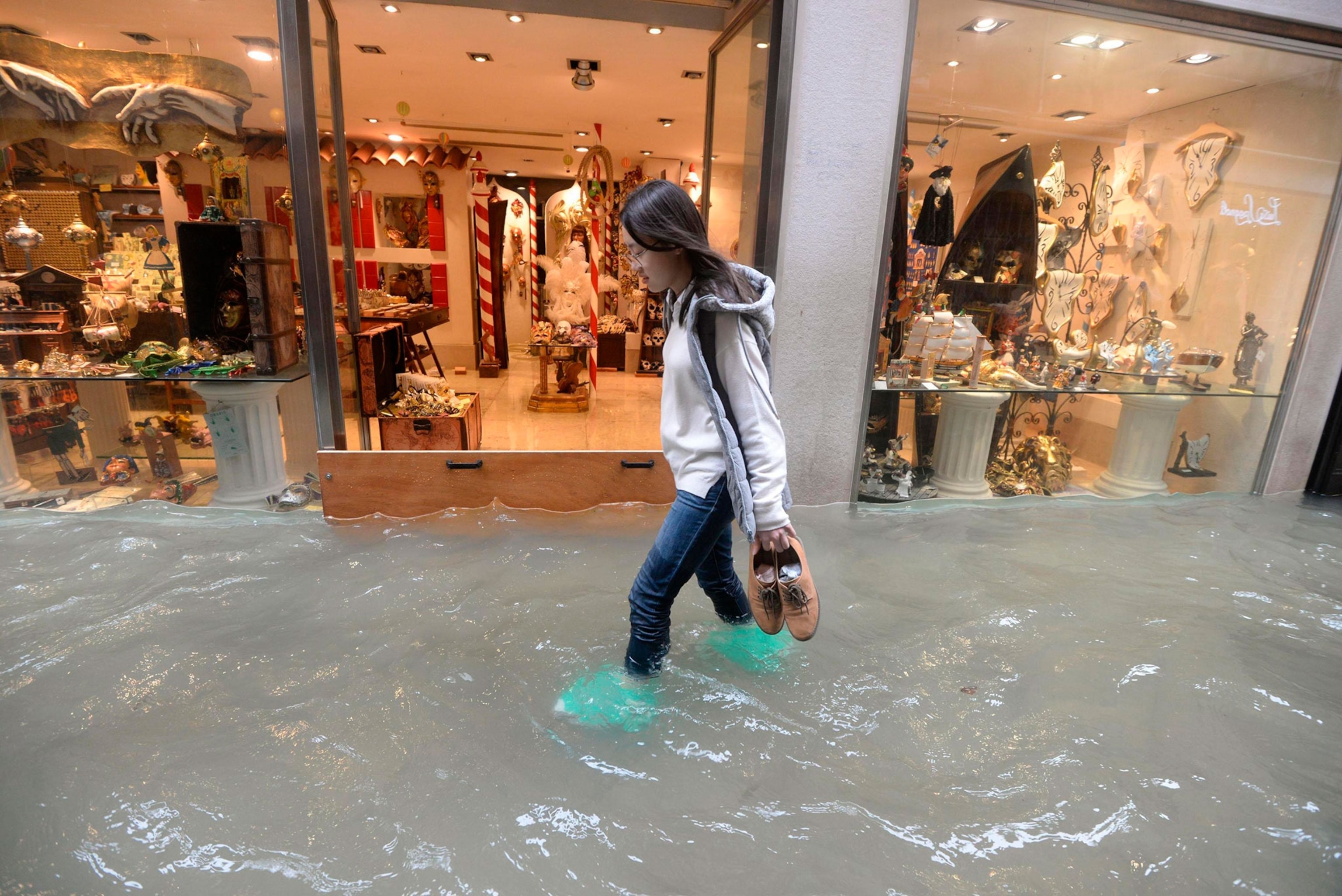 a woman in flooded Venice