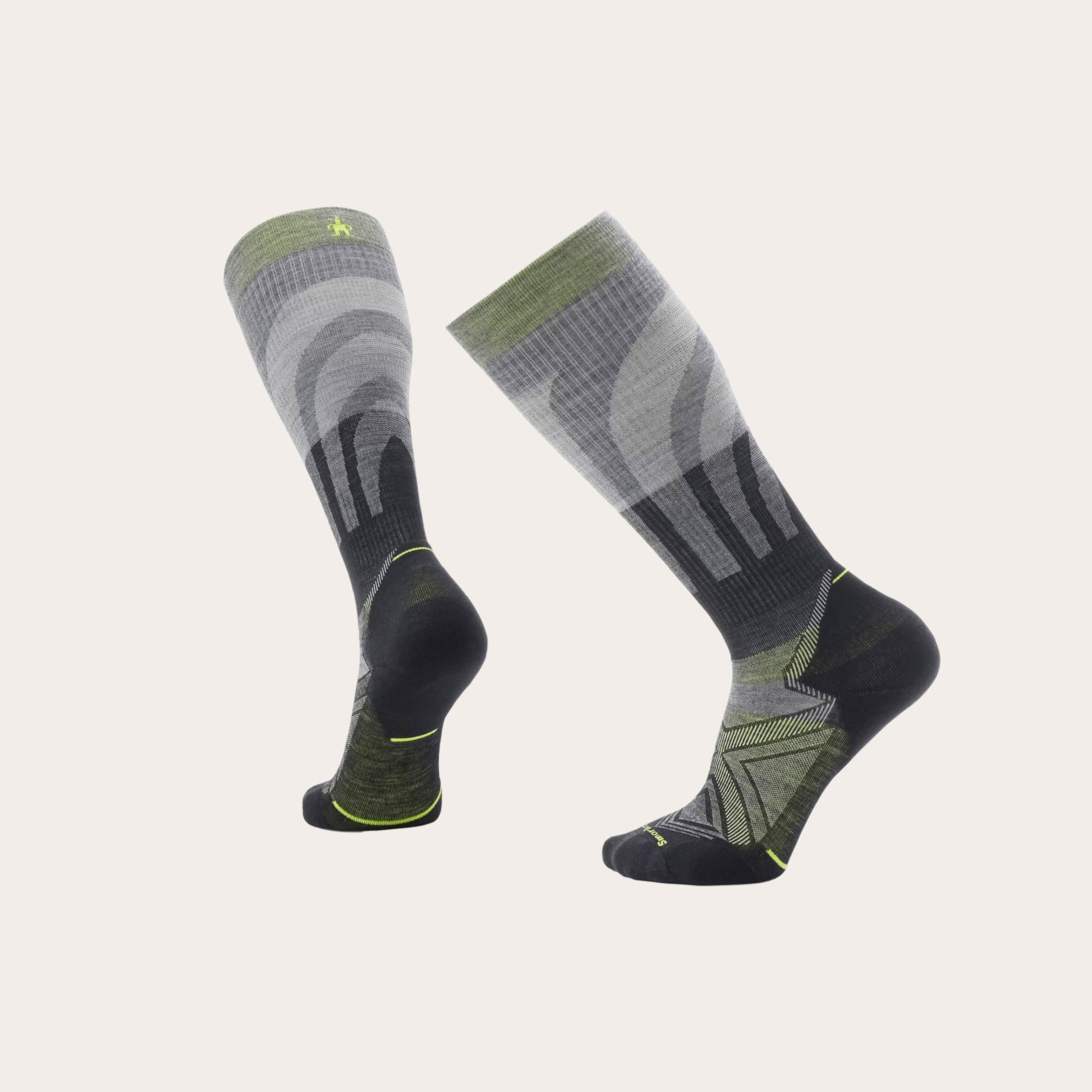 A pair of tall socks placed on a tan background.