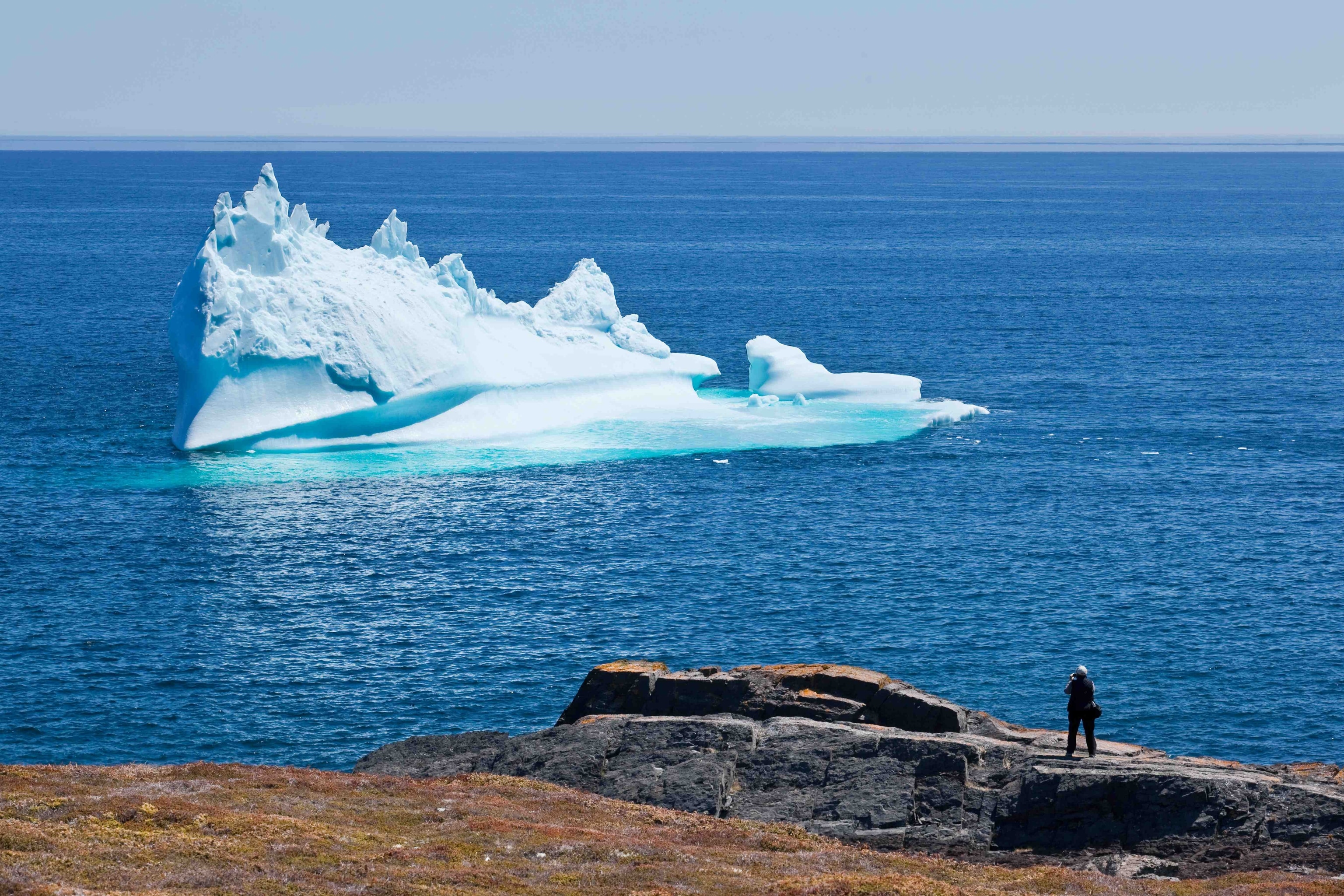 an iceberg floating off in the coast of Newfoundland