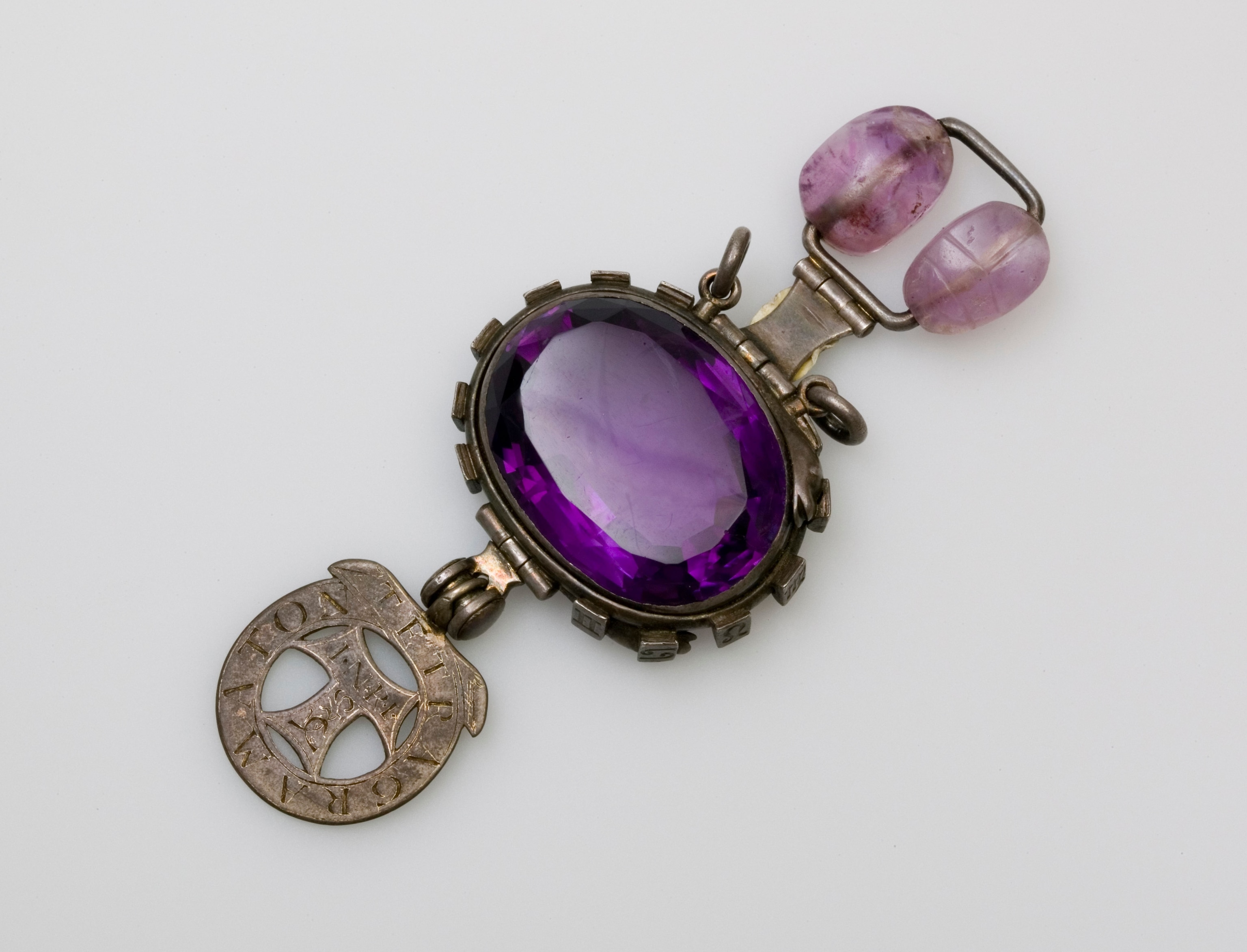 a large purple stone set in metal