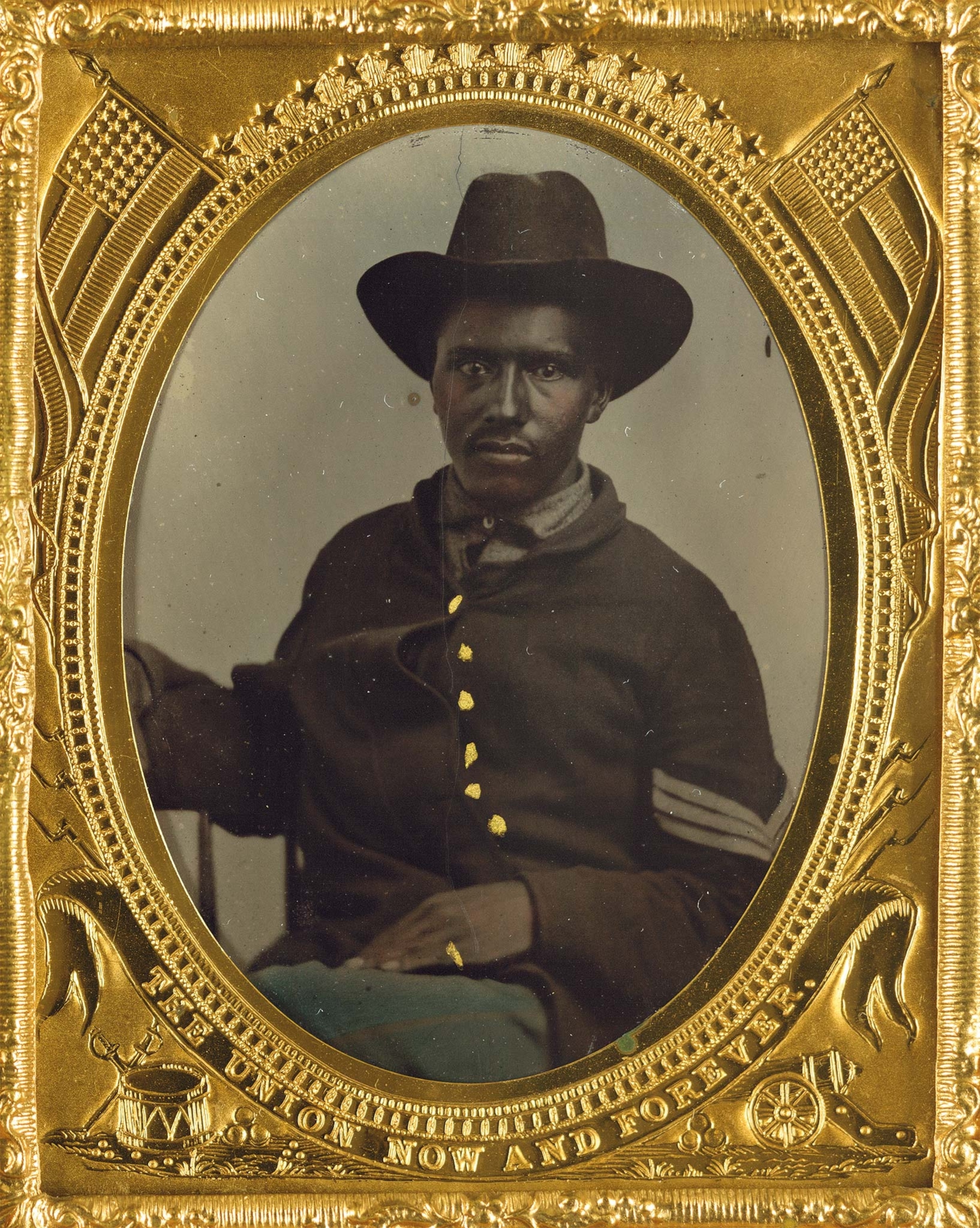 An unidentified Union corporal sits for the camera, surrounded by a gold frame