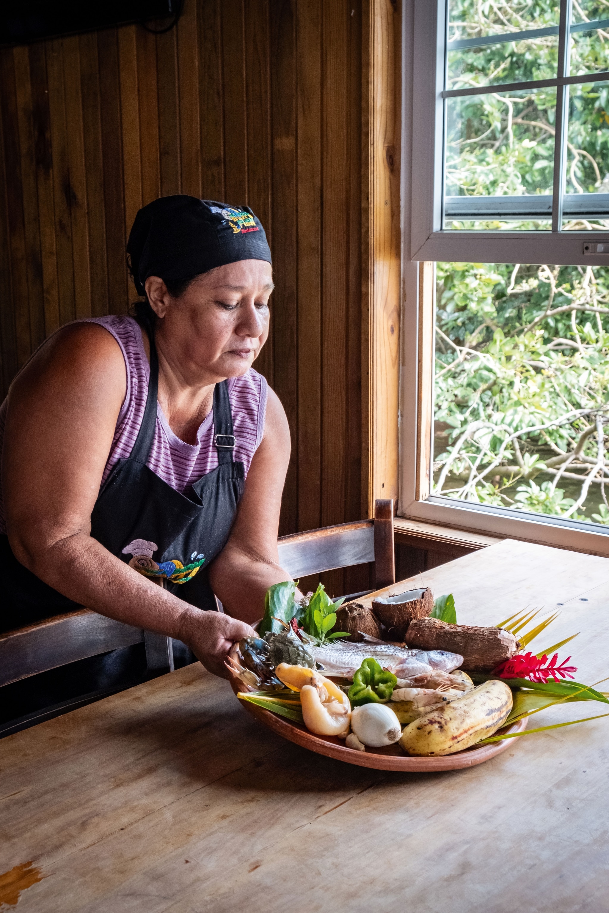 Chef María Luisa Cobos with fresh ingredients to prepare tapado.