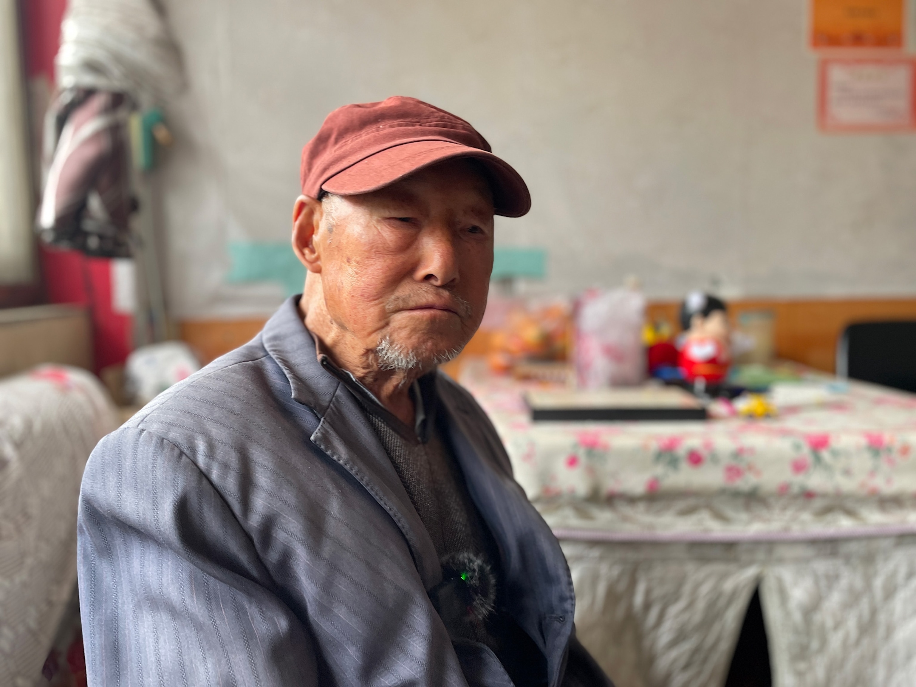 Photo of man wearing red cap