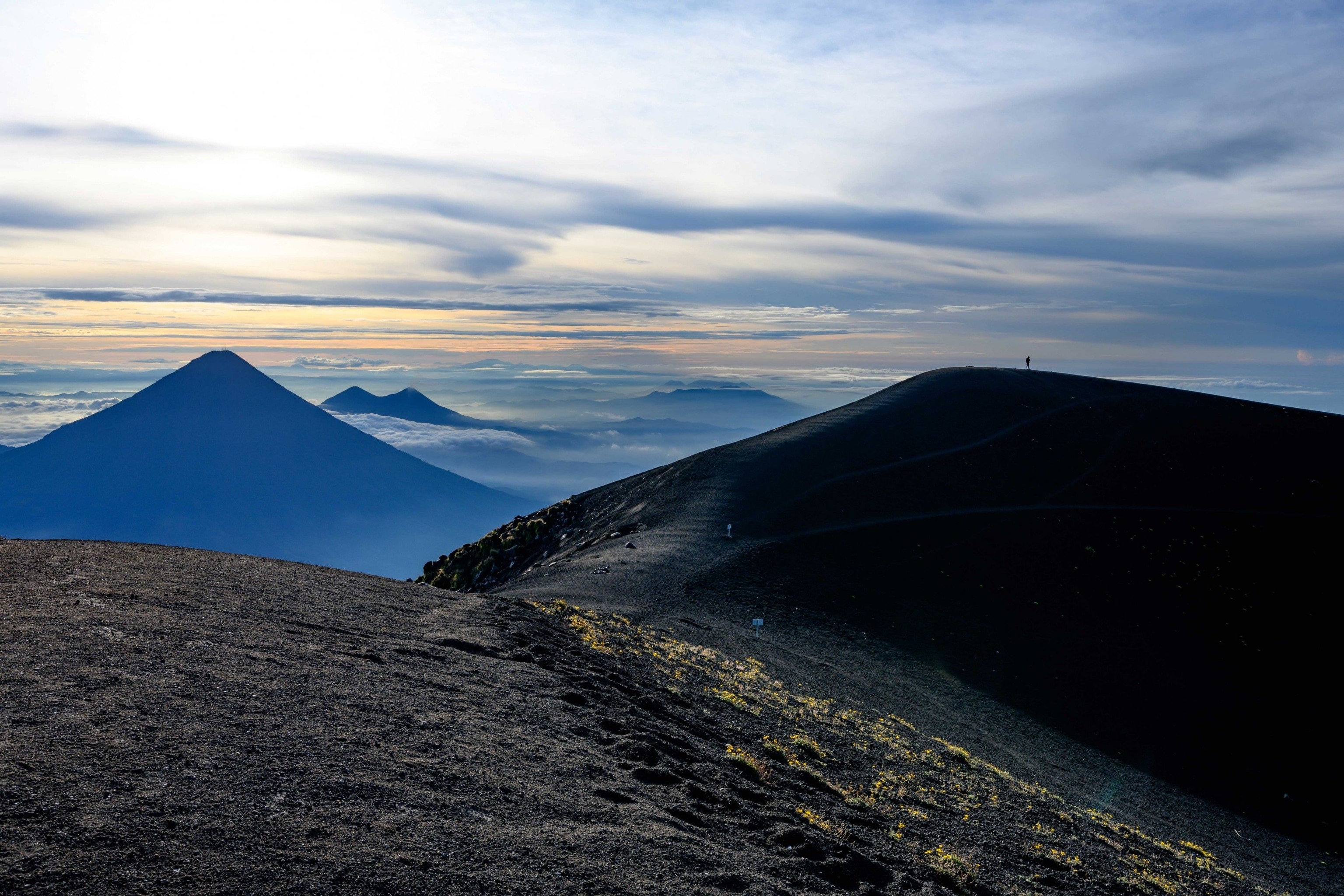 A lone hiker stands atop Acatenango, part of a chain of volcanoes that stretches through the Western Highlands.