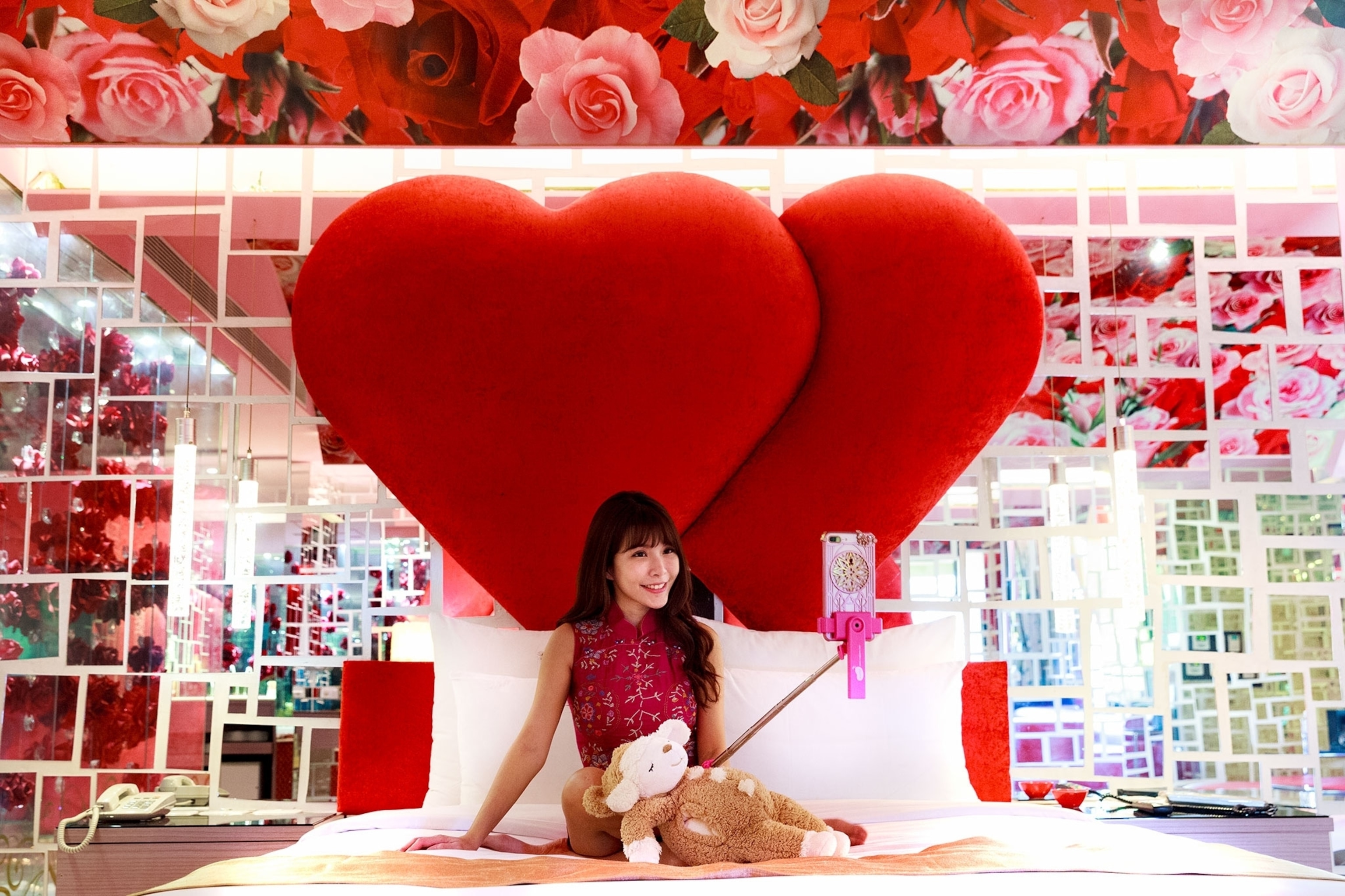a woman livestreaming from a love hotel in Taiwan