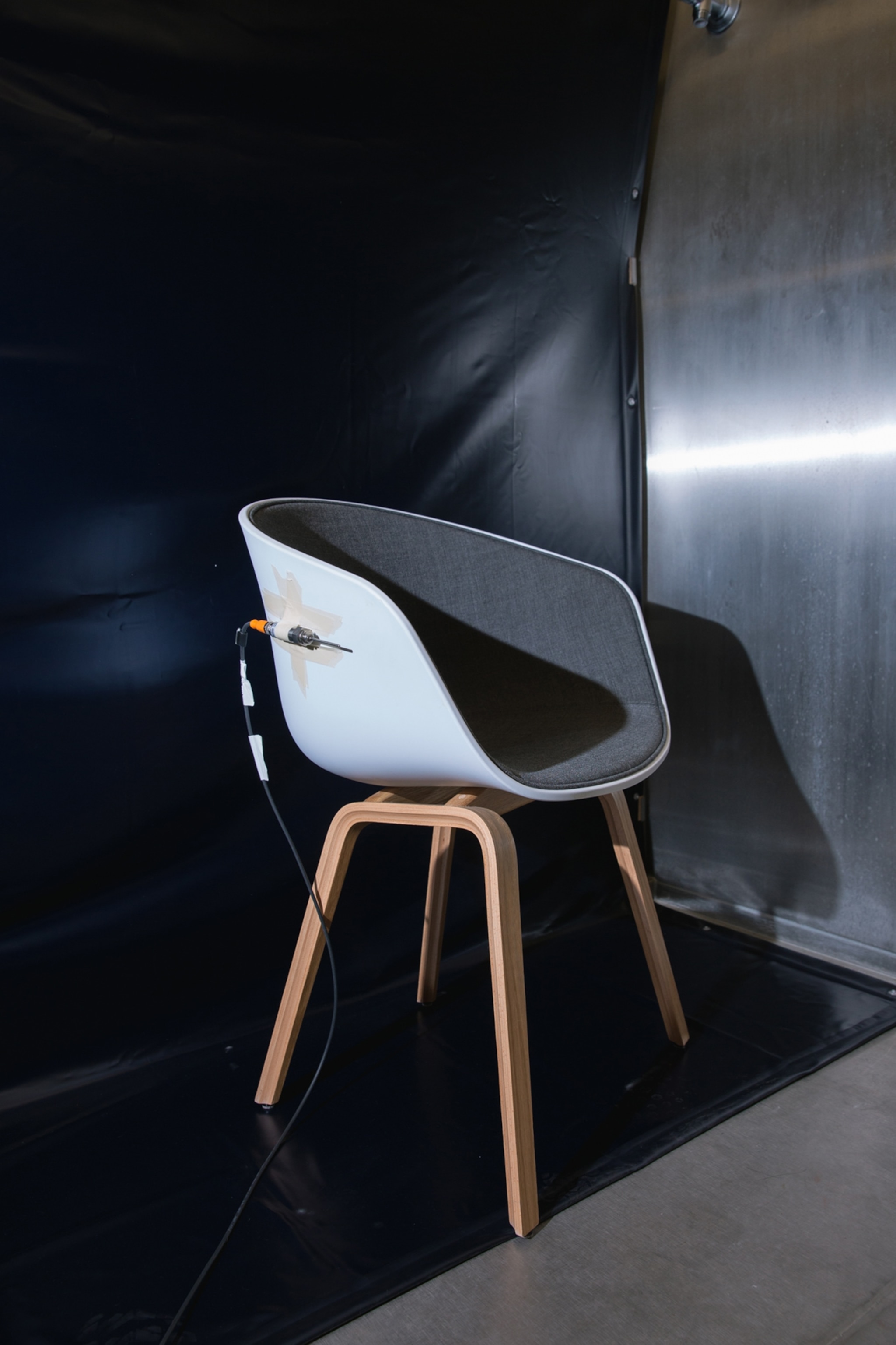 A temperature sensor is attached to a chair in one of the thermal chambers of terraXcube, in preparation for an experiment about thermal perception at the center, in Bolzano, Italy.