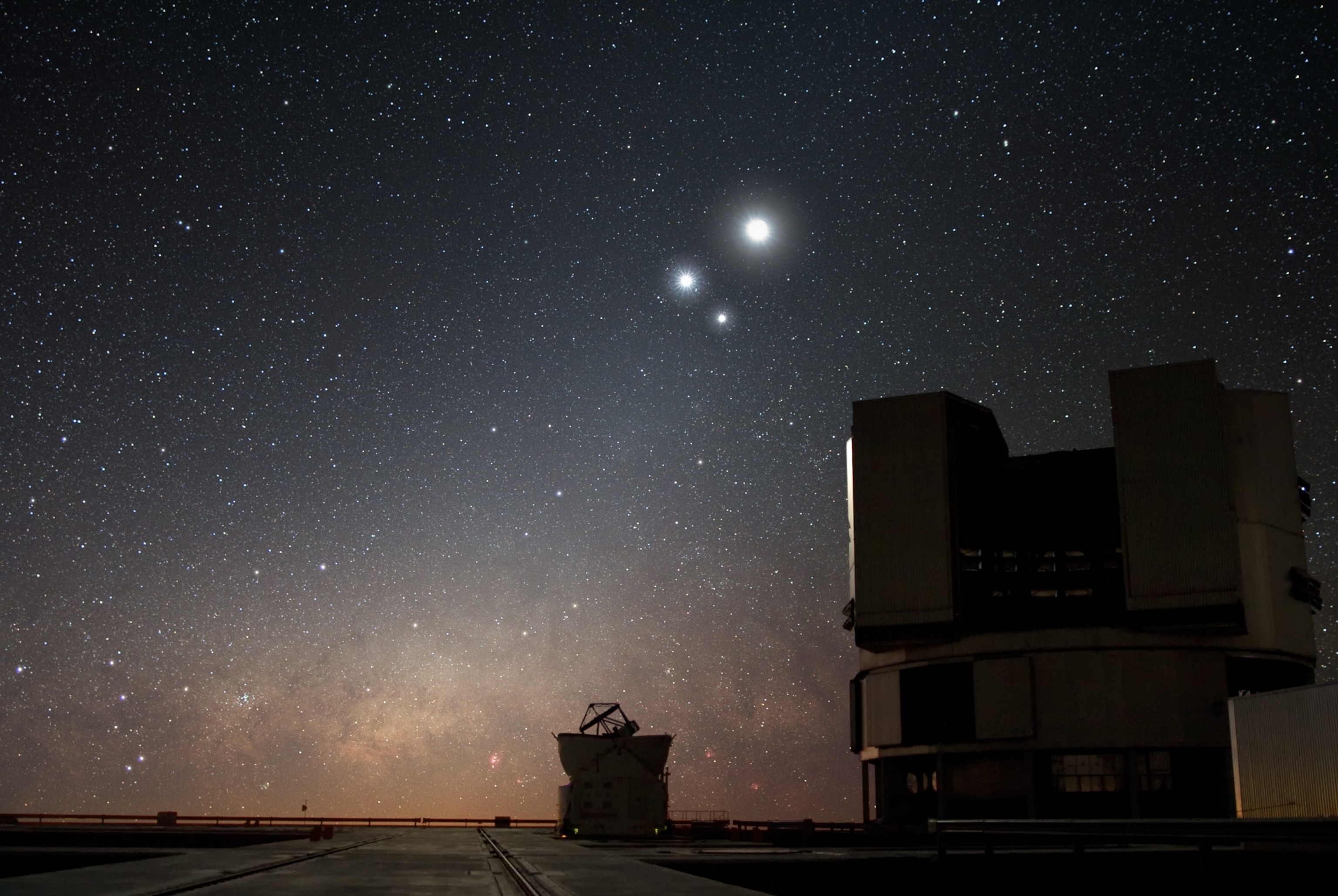 Picture of the night sky above ESO's Very Large Telescrope; Venus, Jupiter and Earth's Moon are seen close together.