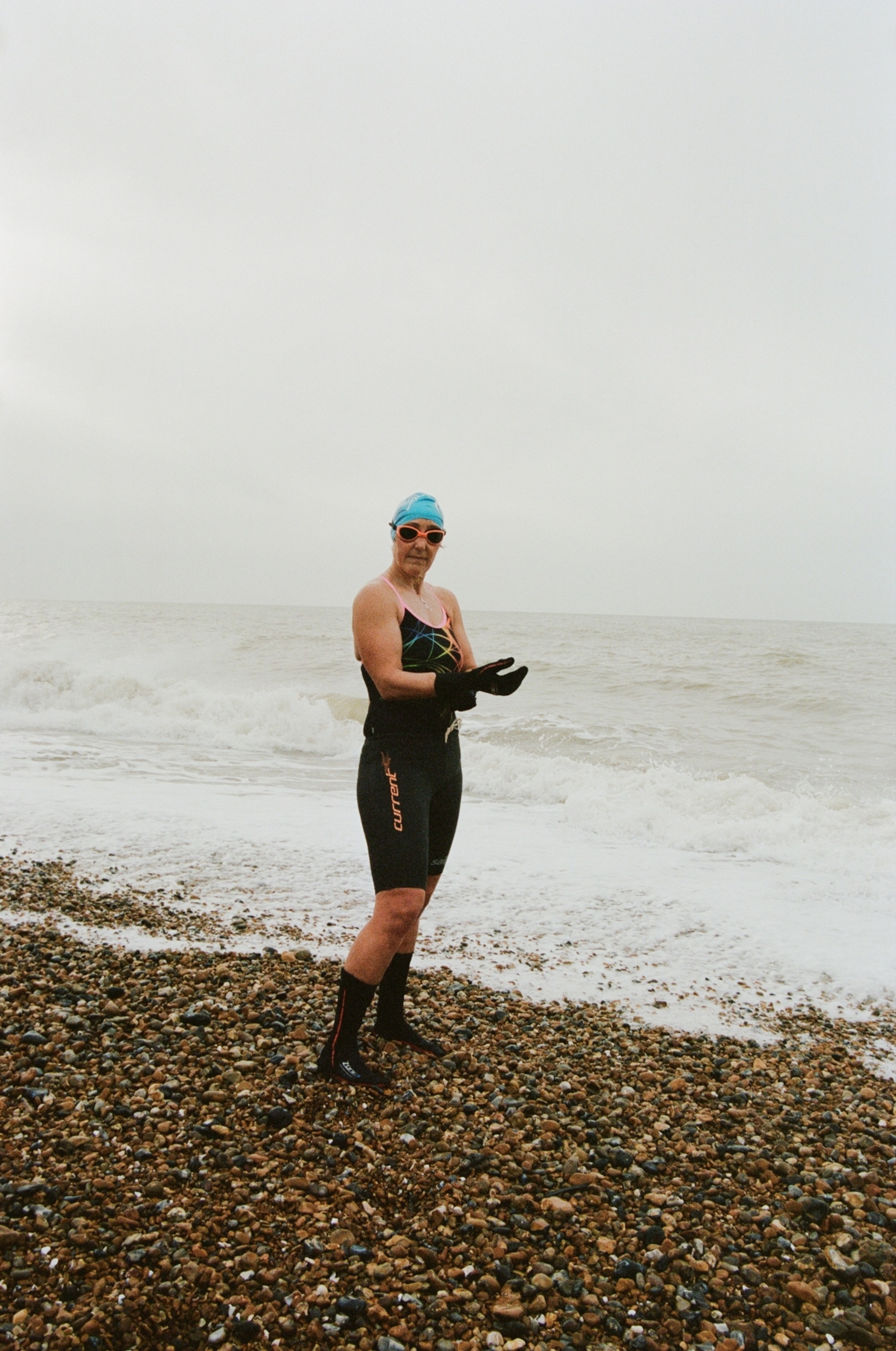 people in the brighton beach cold swimming club in england