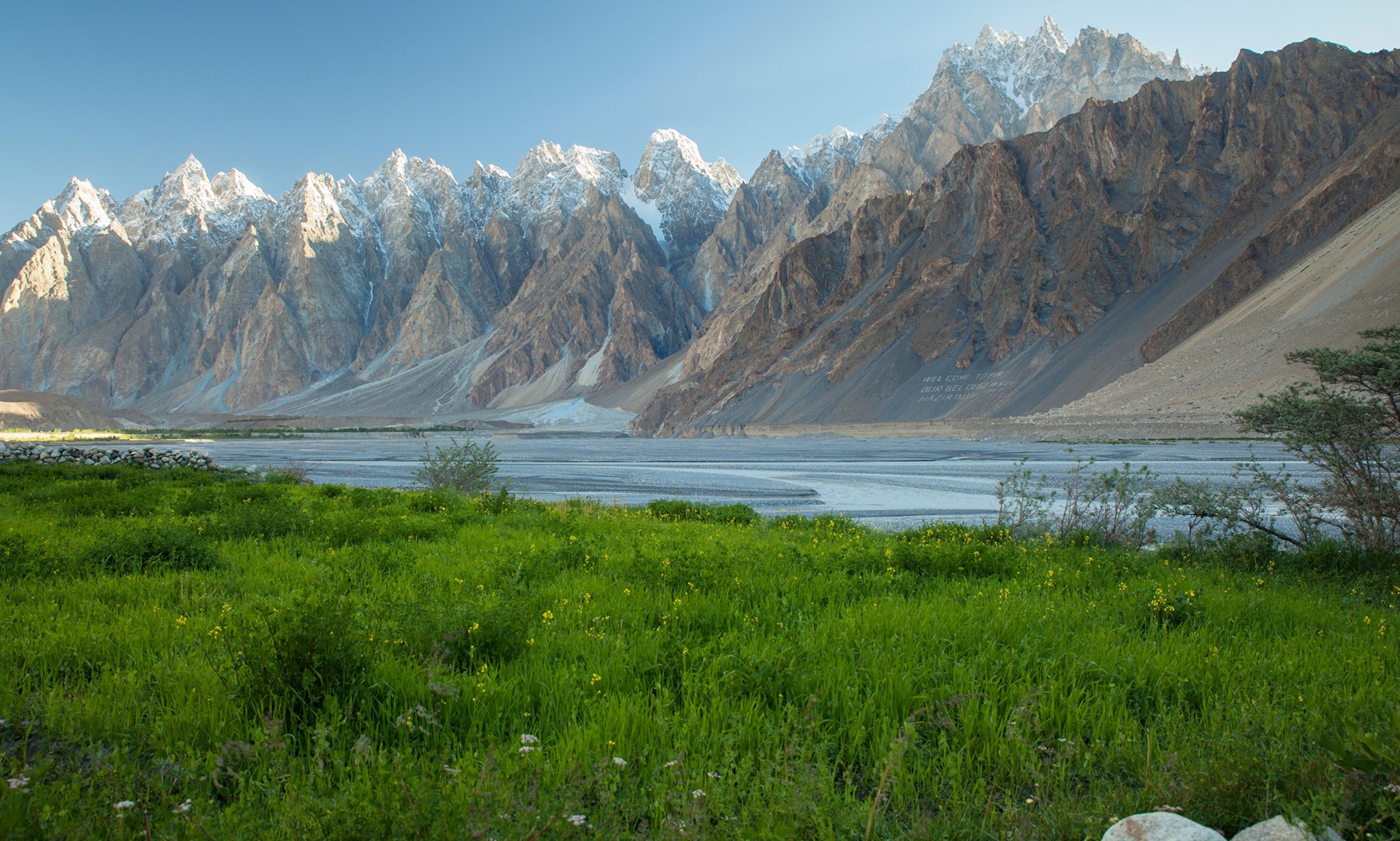Tupopdan peaks and meadow along Hunza river in Passu, Northern Pakistan