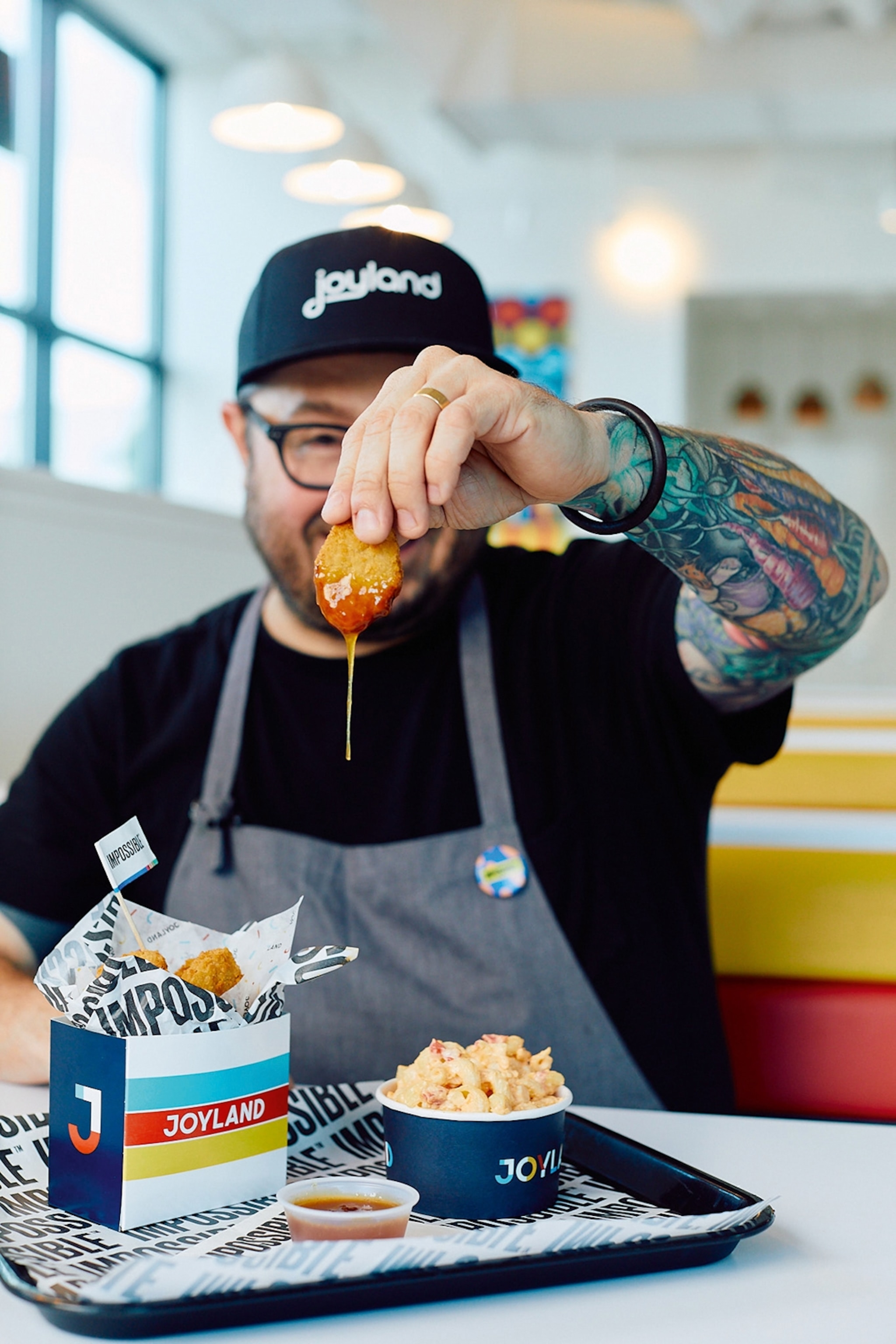 Sean Brock with chicken nuggets and dip at Joyland.
