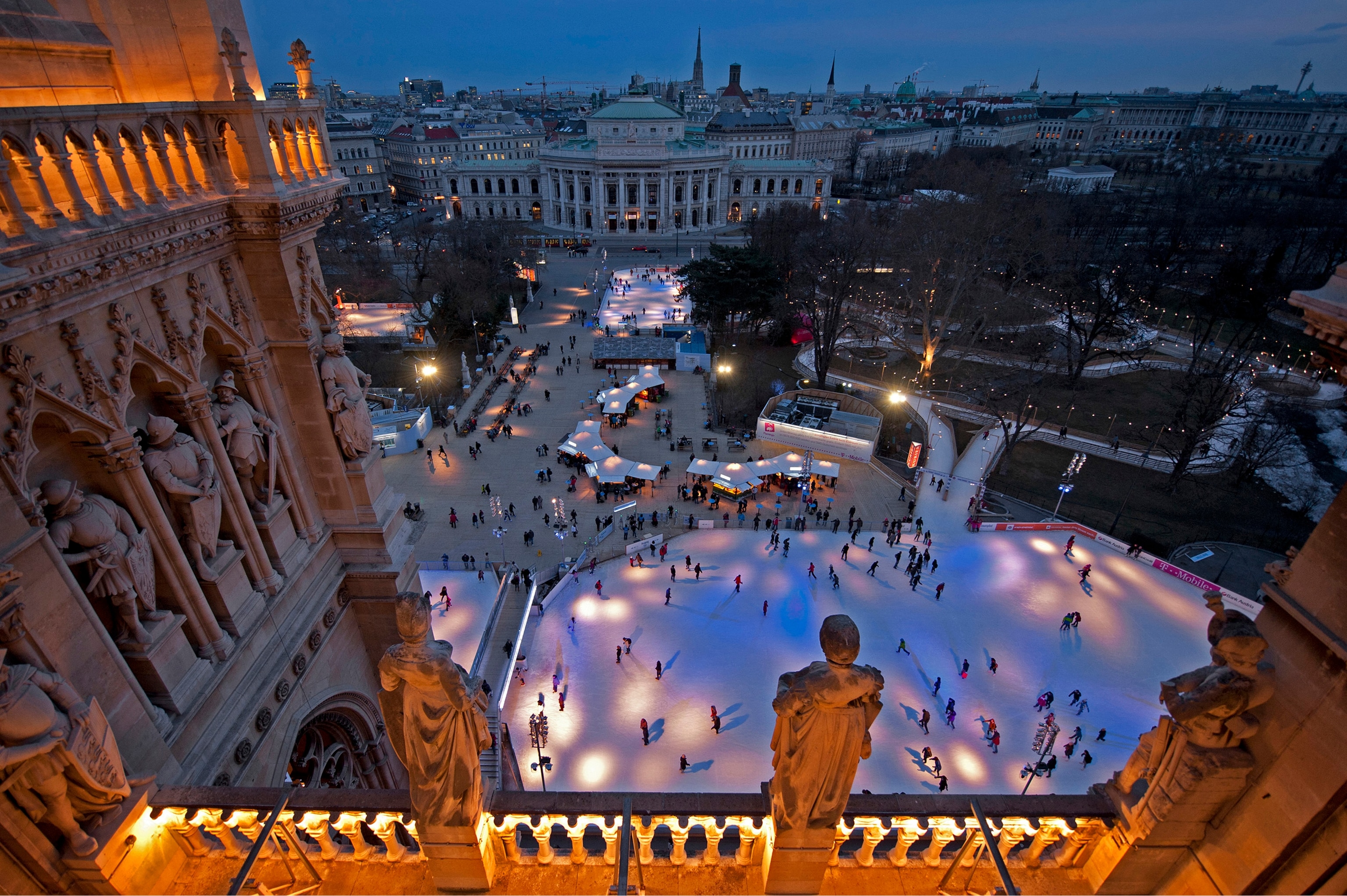 an aerial view of the skating rink in the town square in Vienna