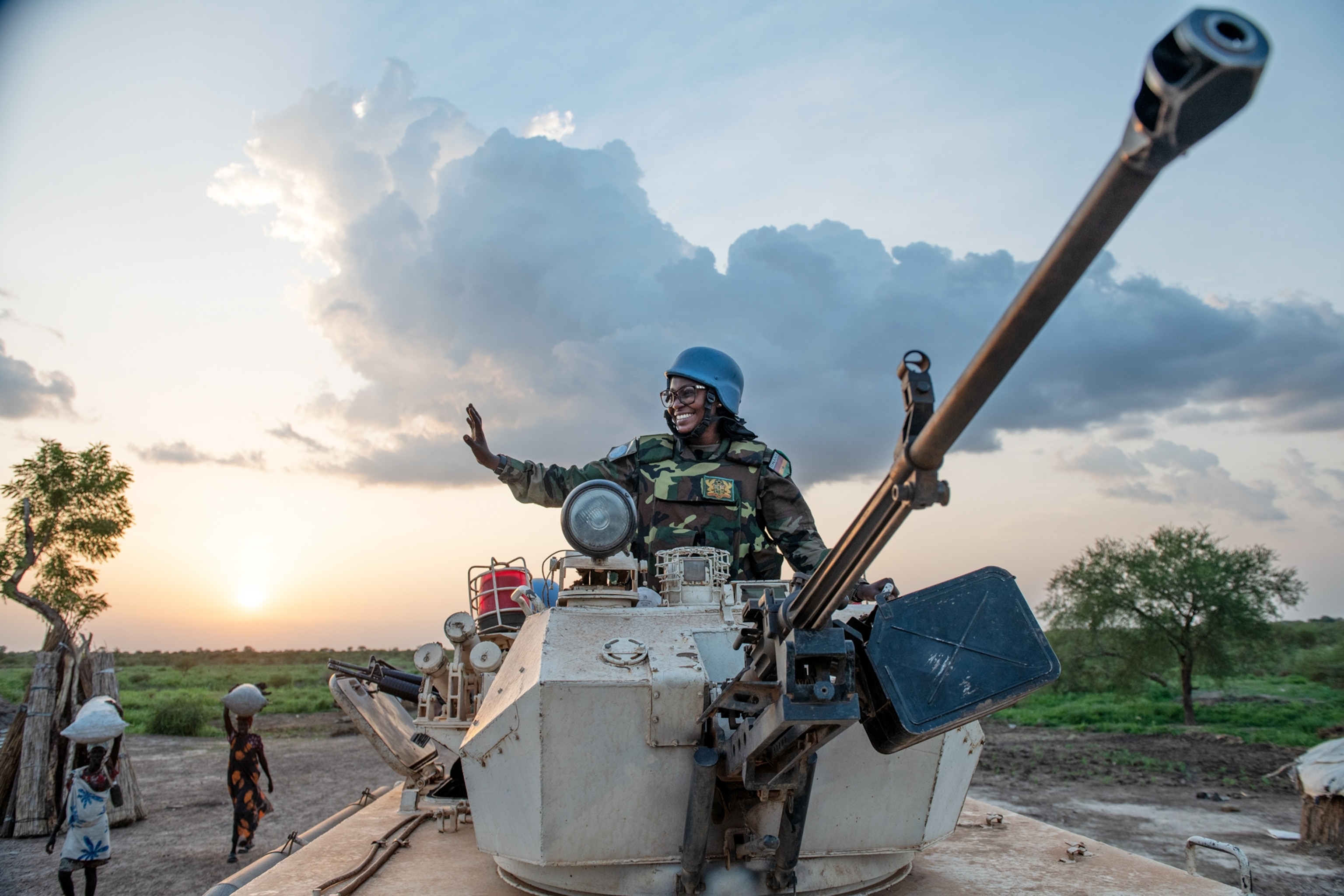 a woman waving while in a tank