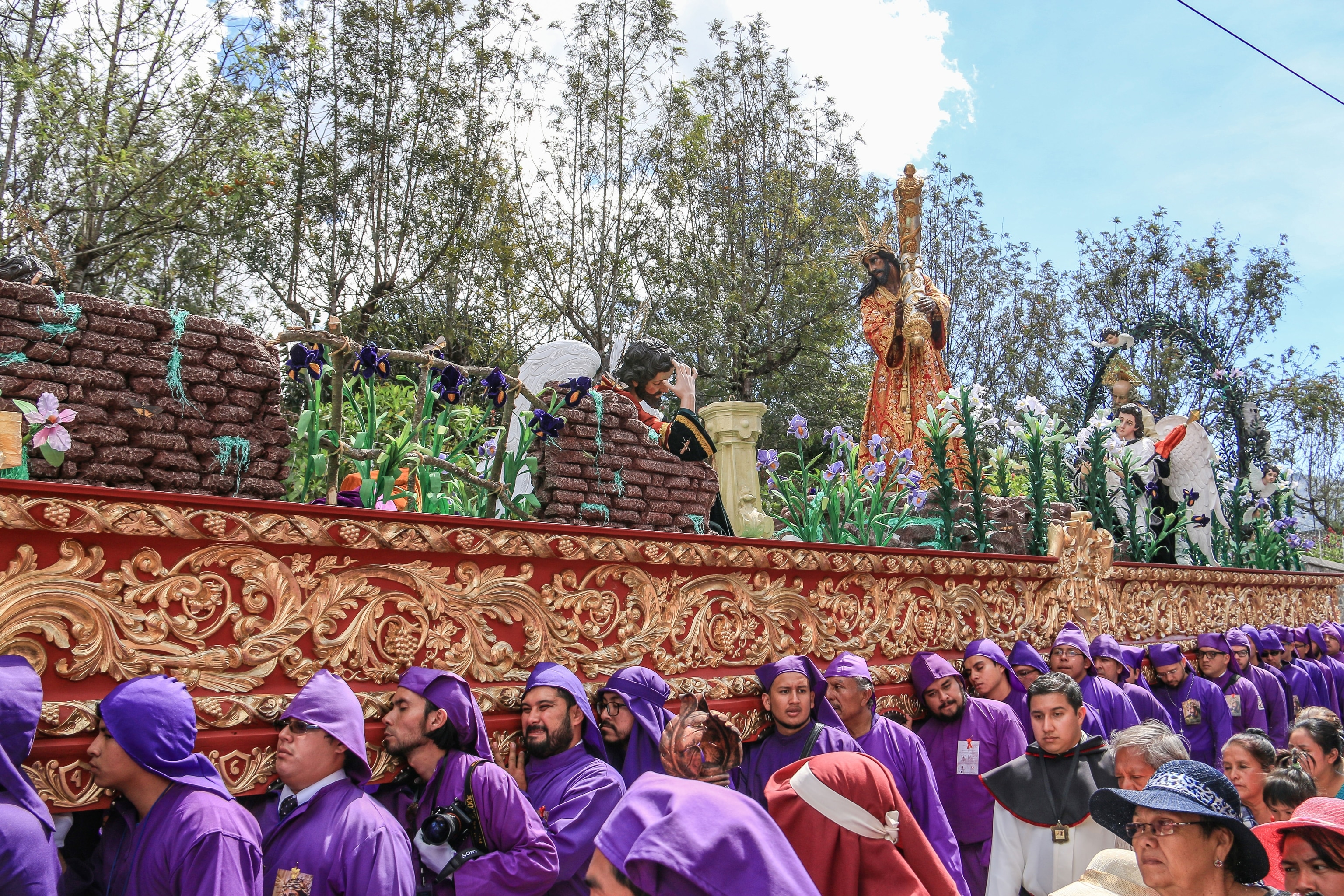 A Semana Santa procession in Guatemala, featuring an oversized wooden float.