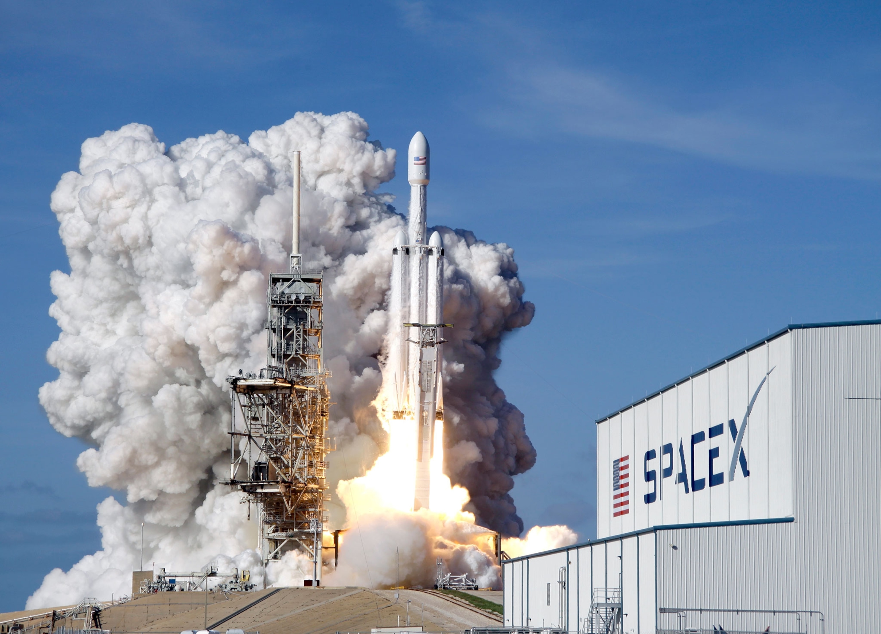 a Falcon 9 SpaceX heavy rocket lifts off from pad 39A.