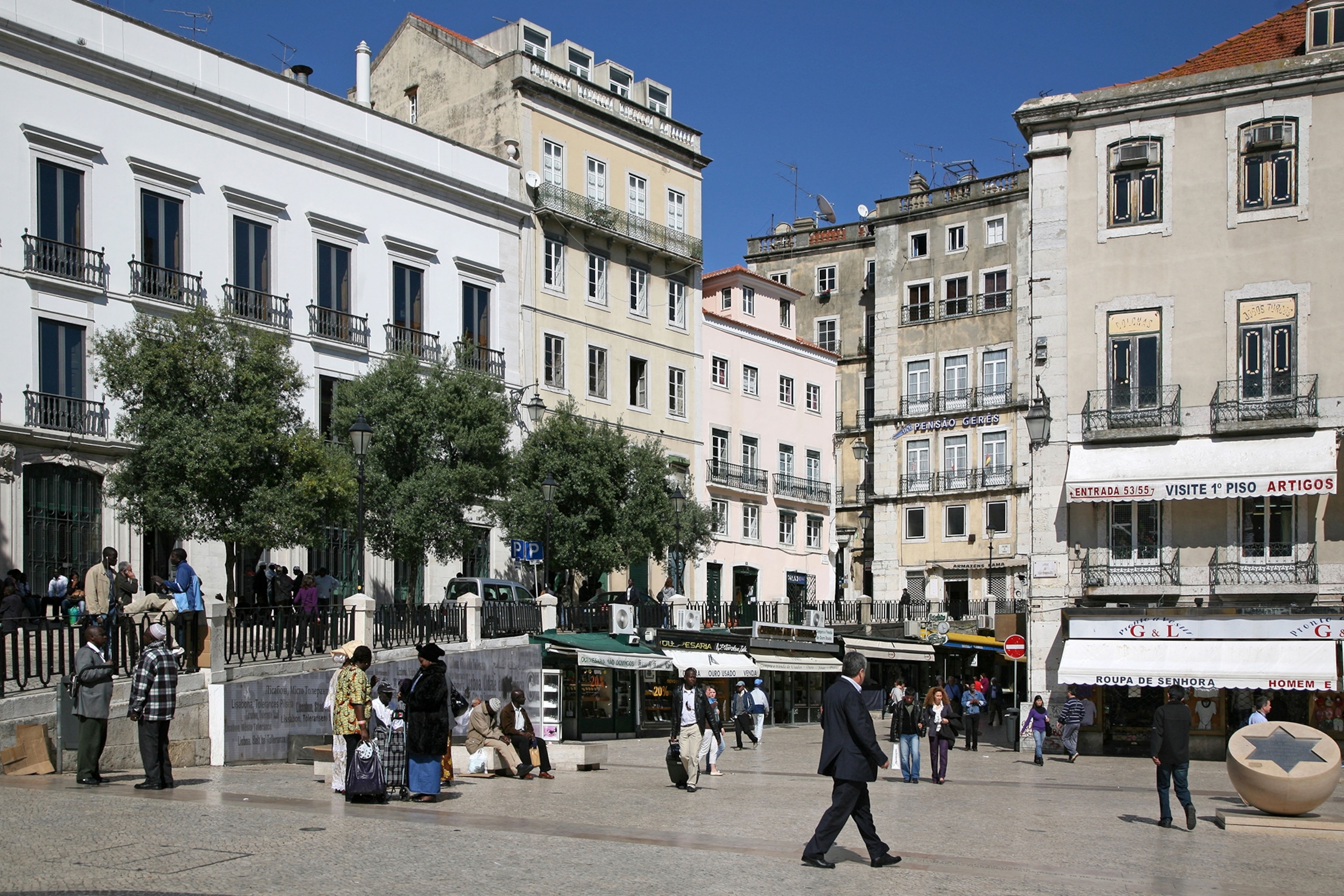 People walk through Sao Domingos