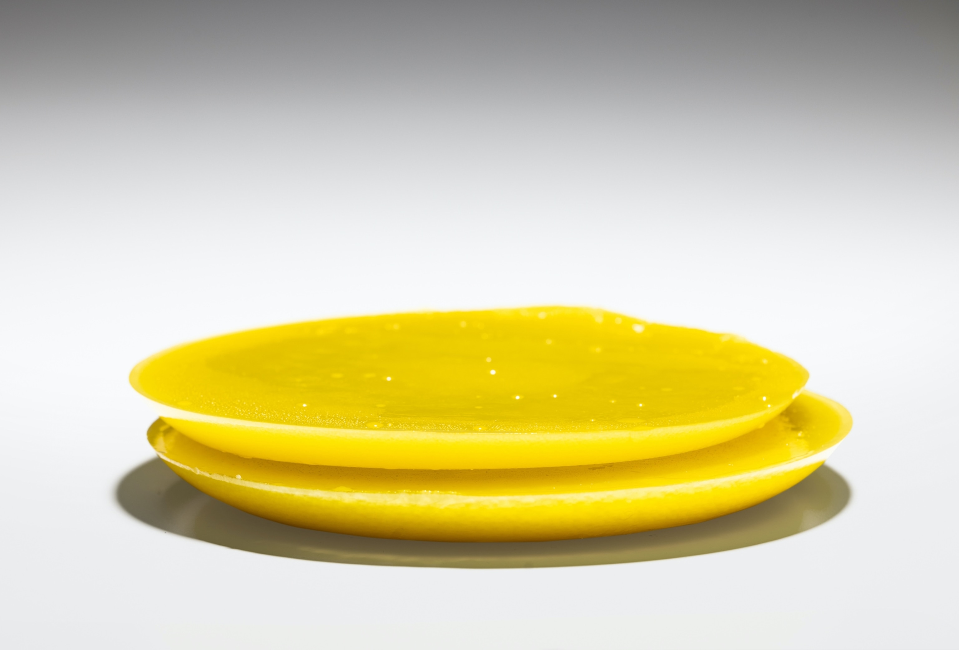 Picture of stacked yellow disks.