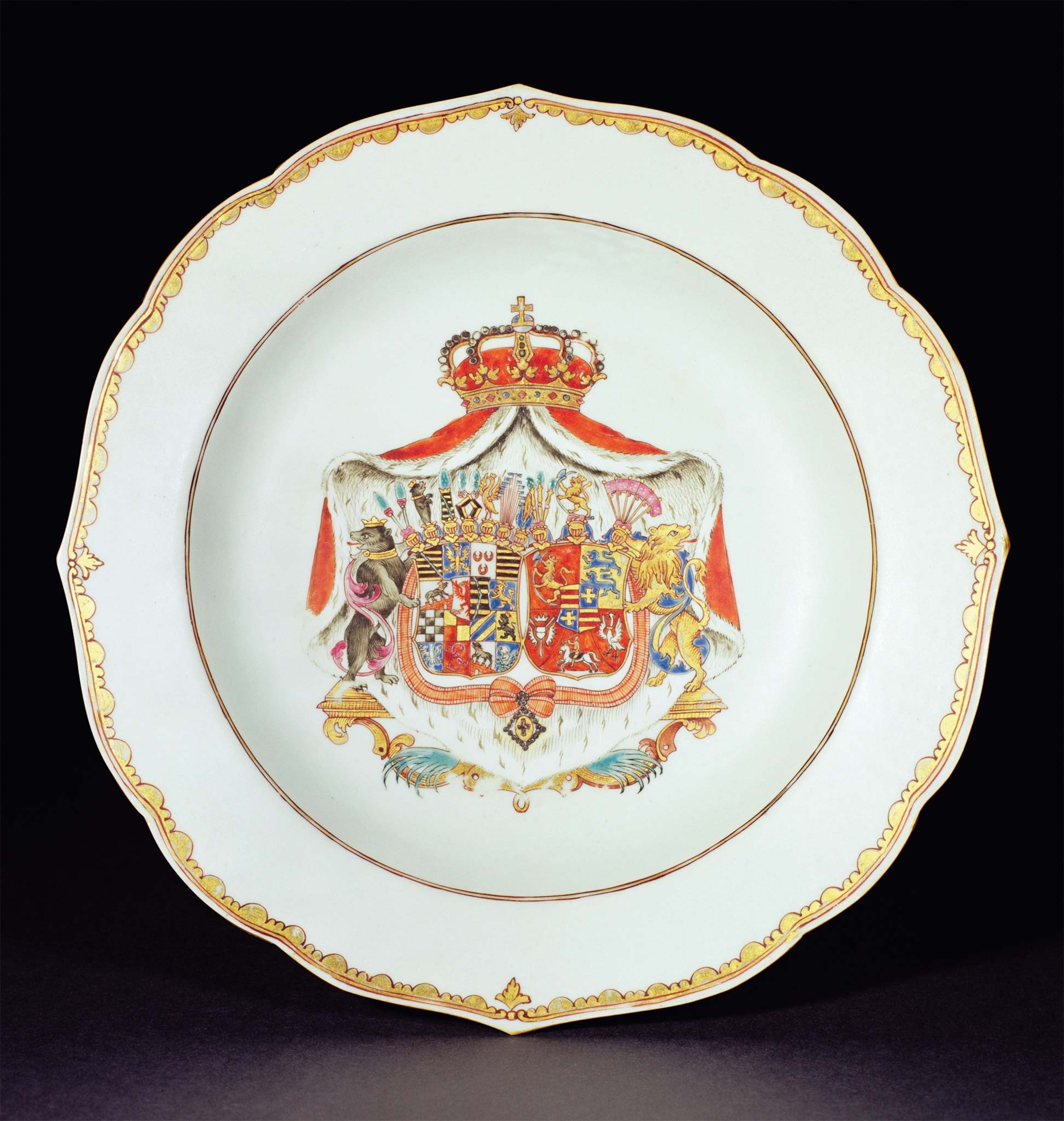 A gilded soup bowl bears the arms of Catherine II's parents.