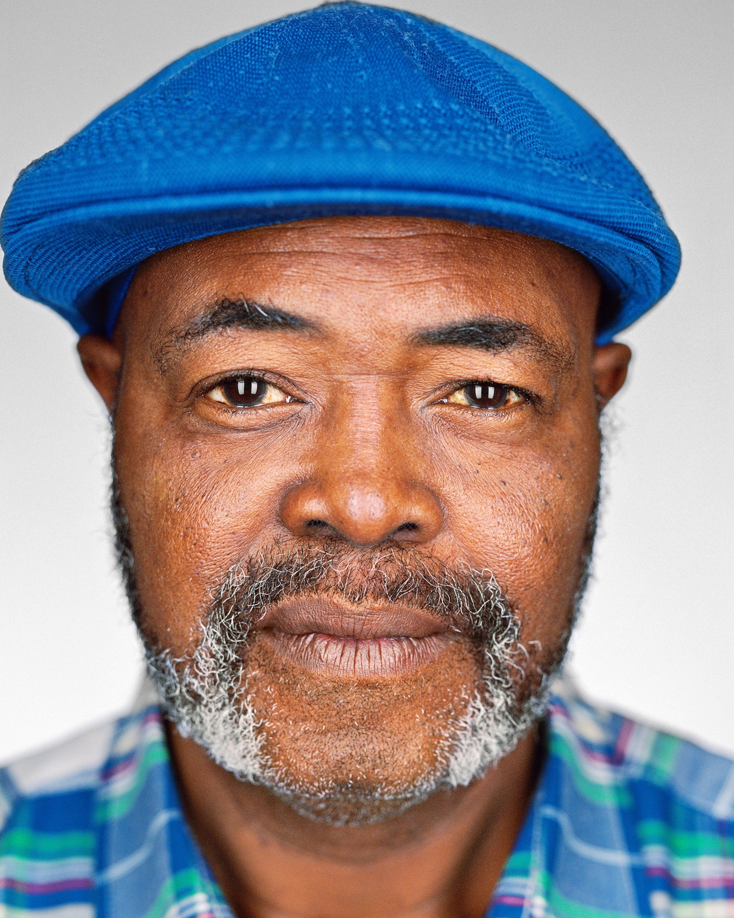 man in blue cap.