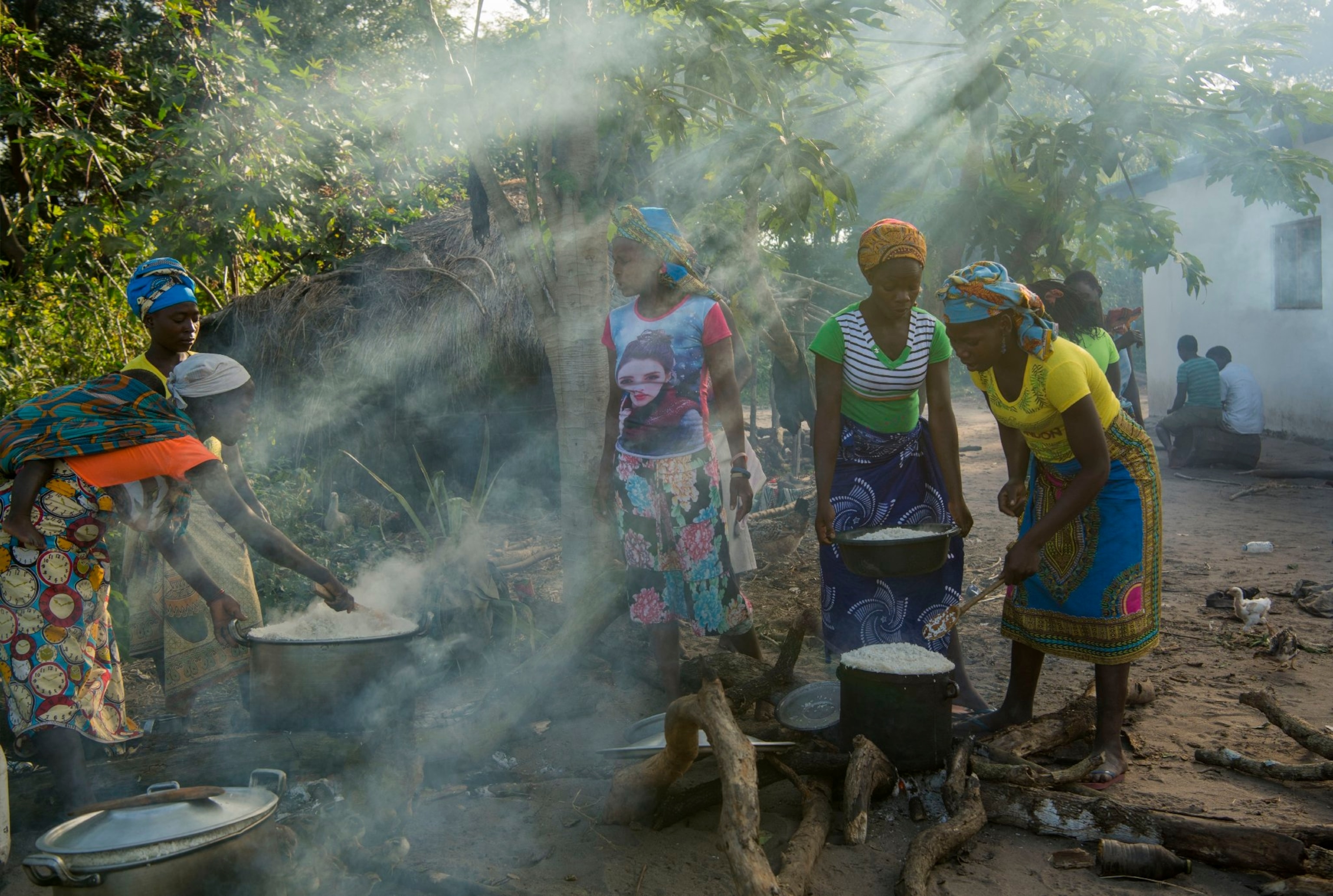 villagers preparing for a ceremony to appease their ancestors