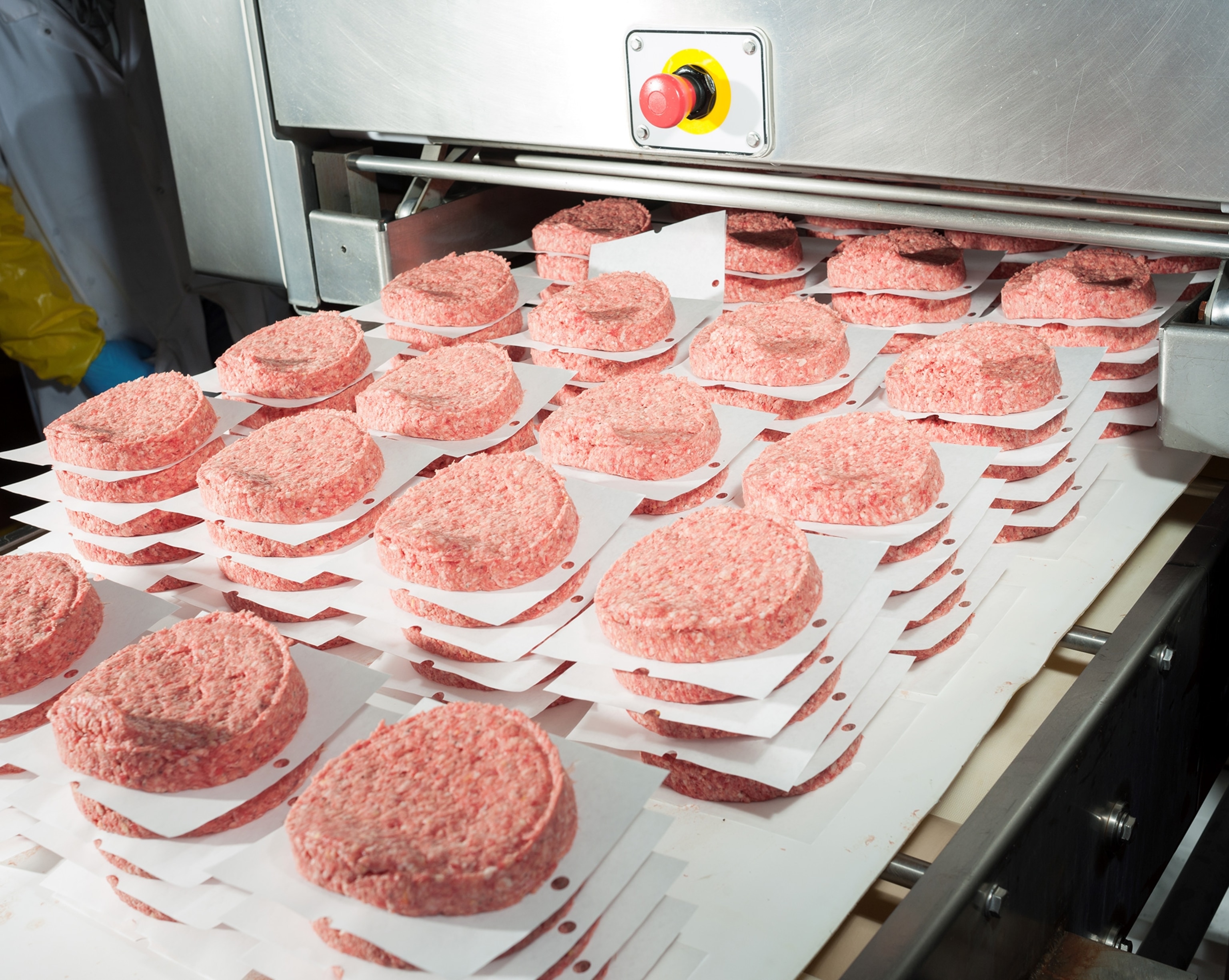 a patty-forming machine at a packing plant in Amarillo, Texas.