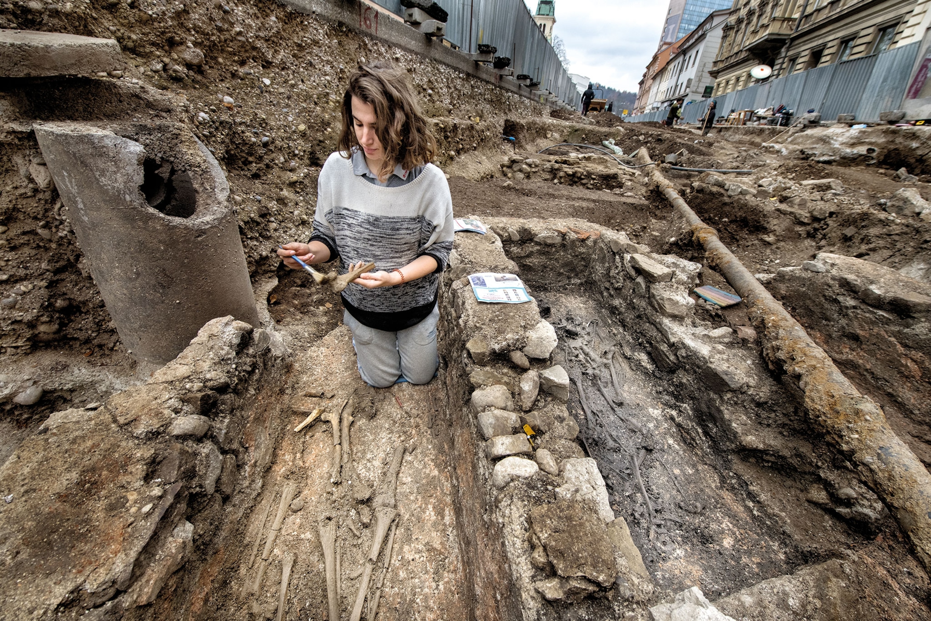 an archaeologist excavating a cemetery
