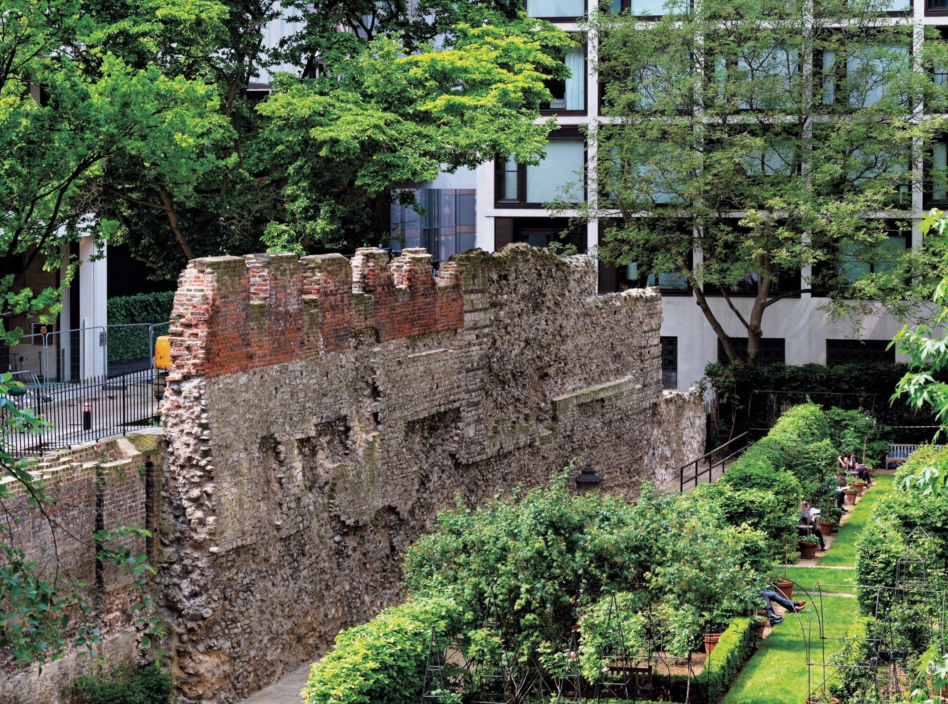 Photo of old wall amidst newer construction