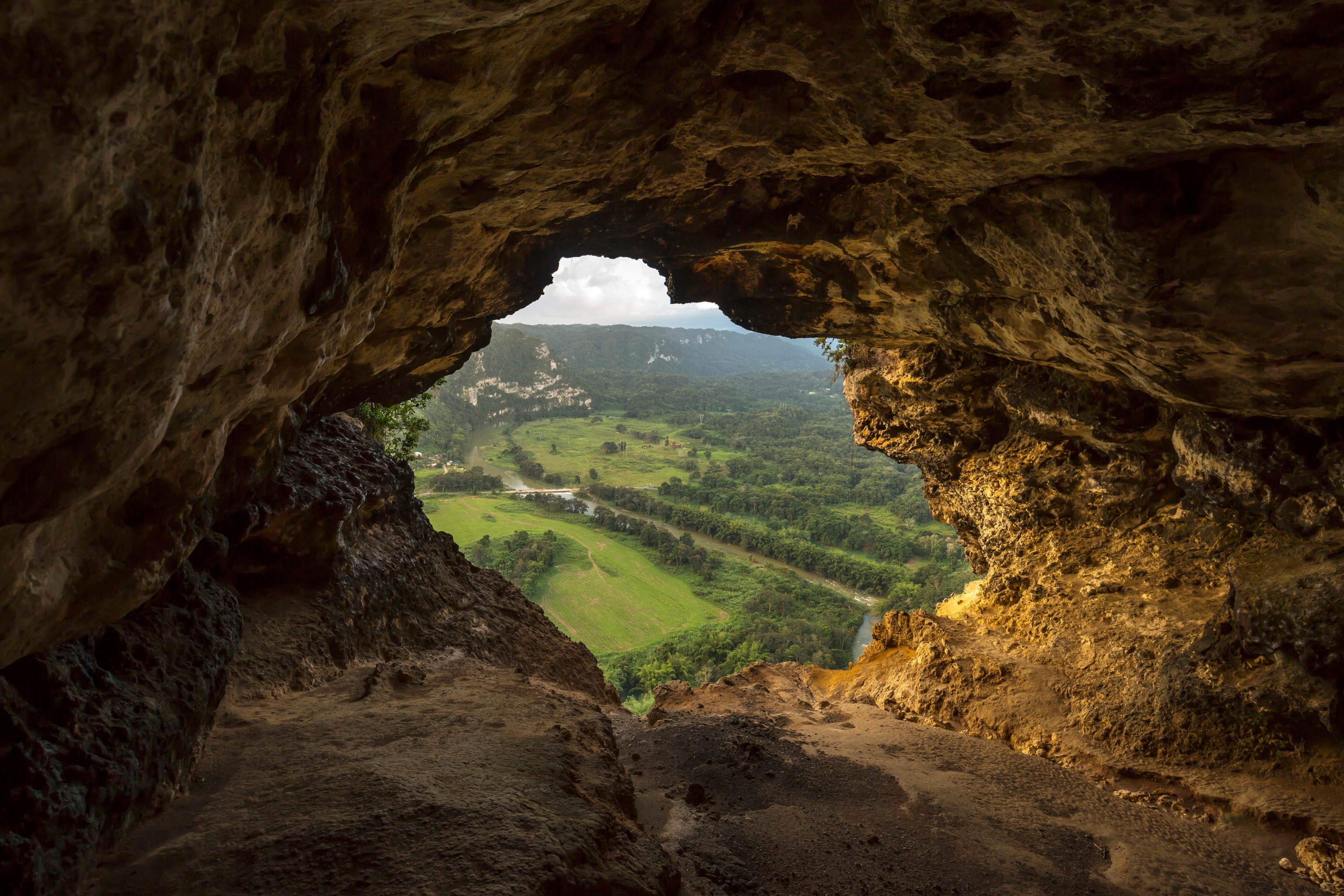 A cave window overlooks the Rio Grande De Arecibo in Arecibo, Puerto Rico