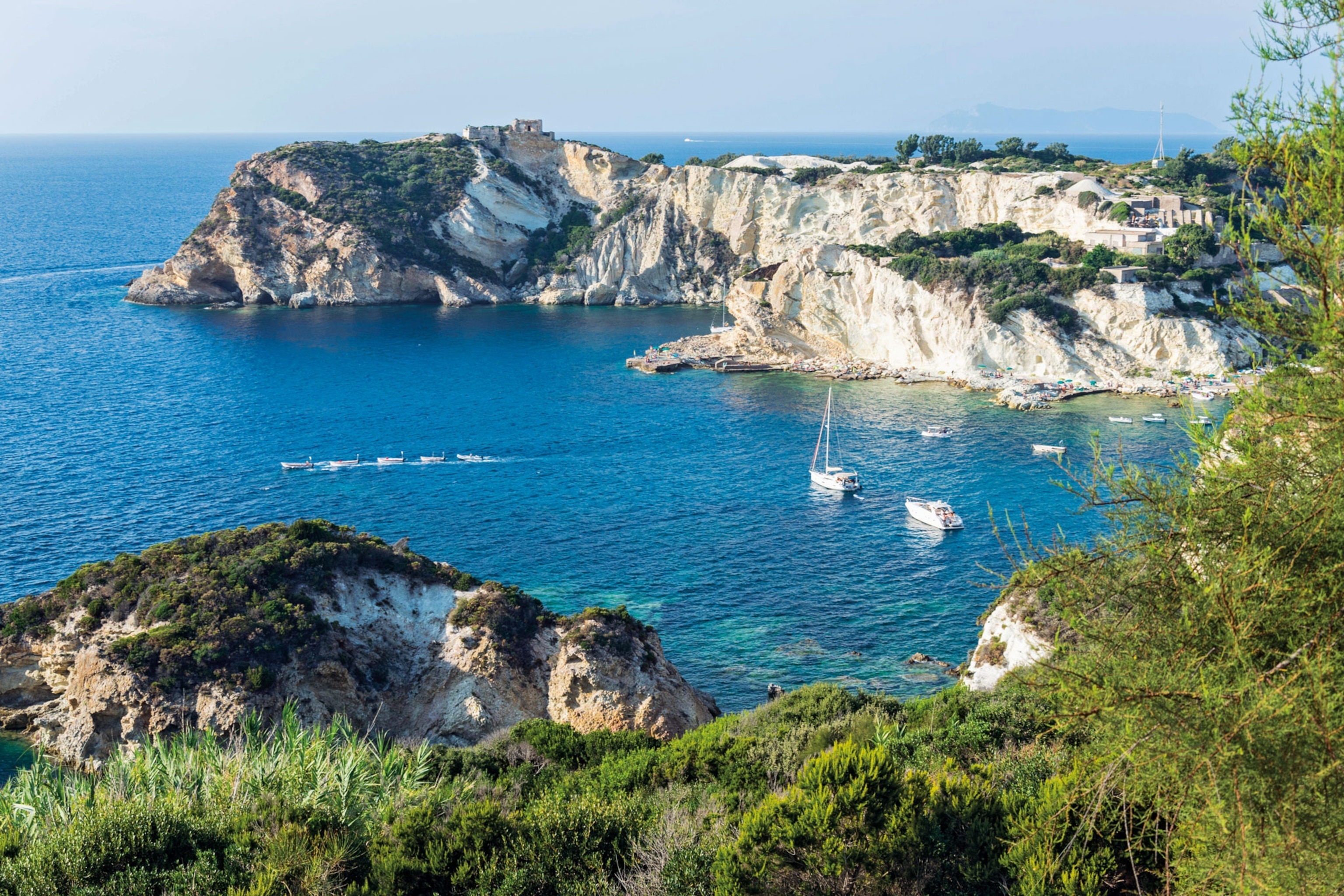 Cliffs along a blue shoreline