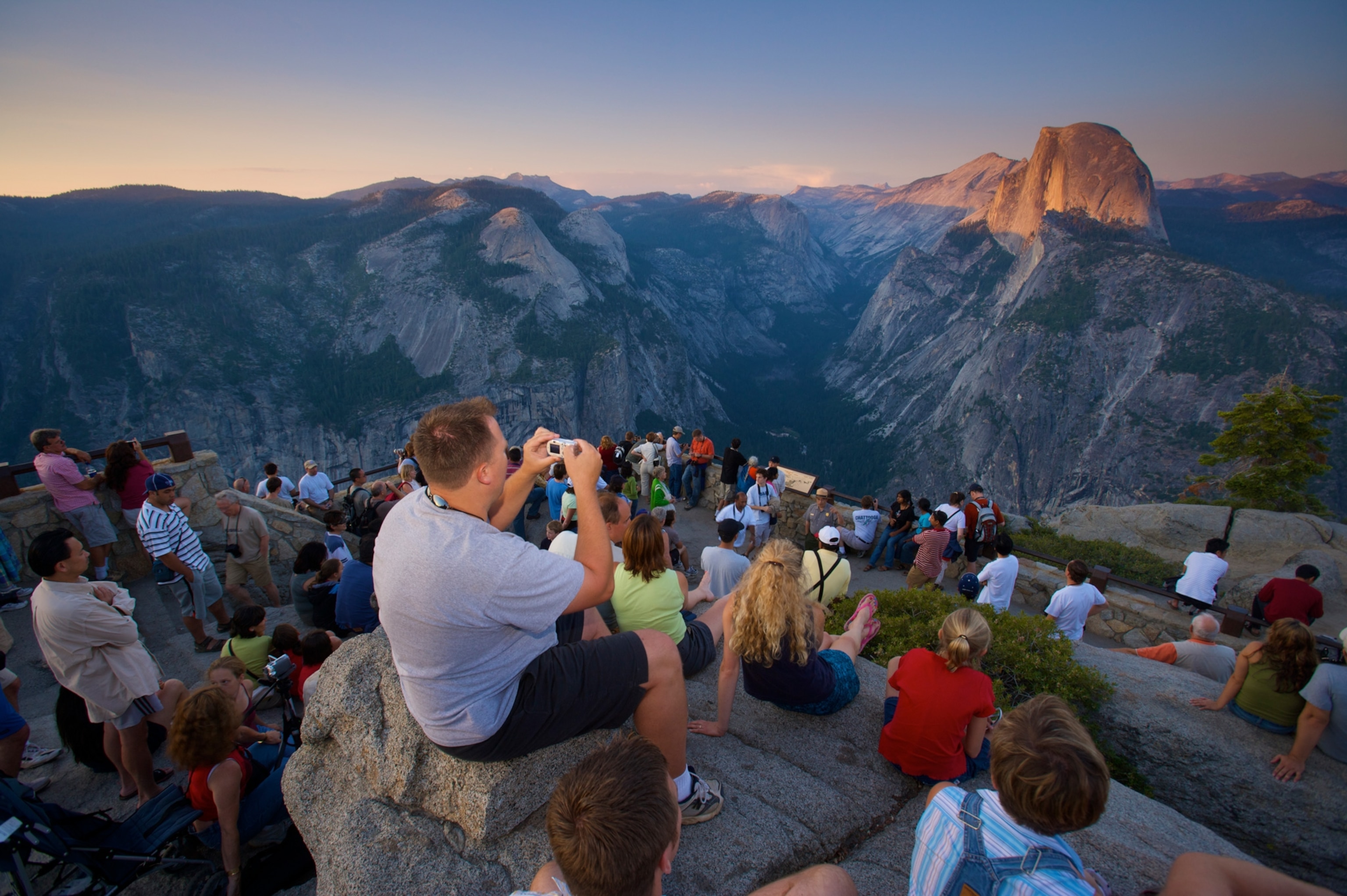 Photo of a crowded ridge of tourists watching sunrise