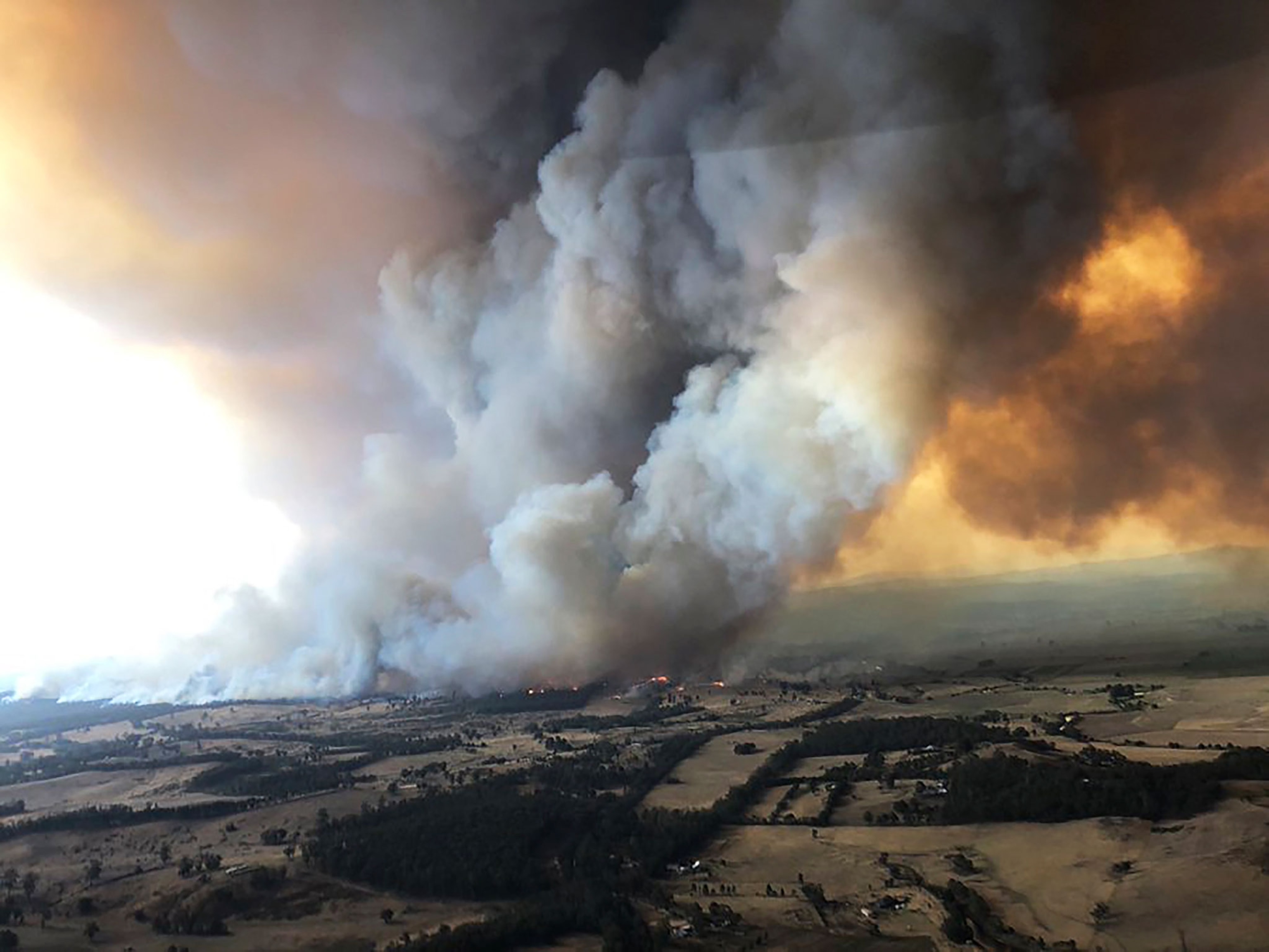 plumes of smoke from wildfires in Bairnsdale, Australia