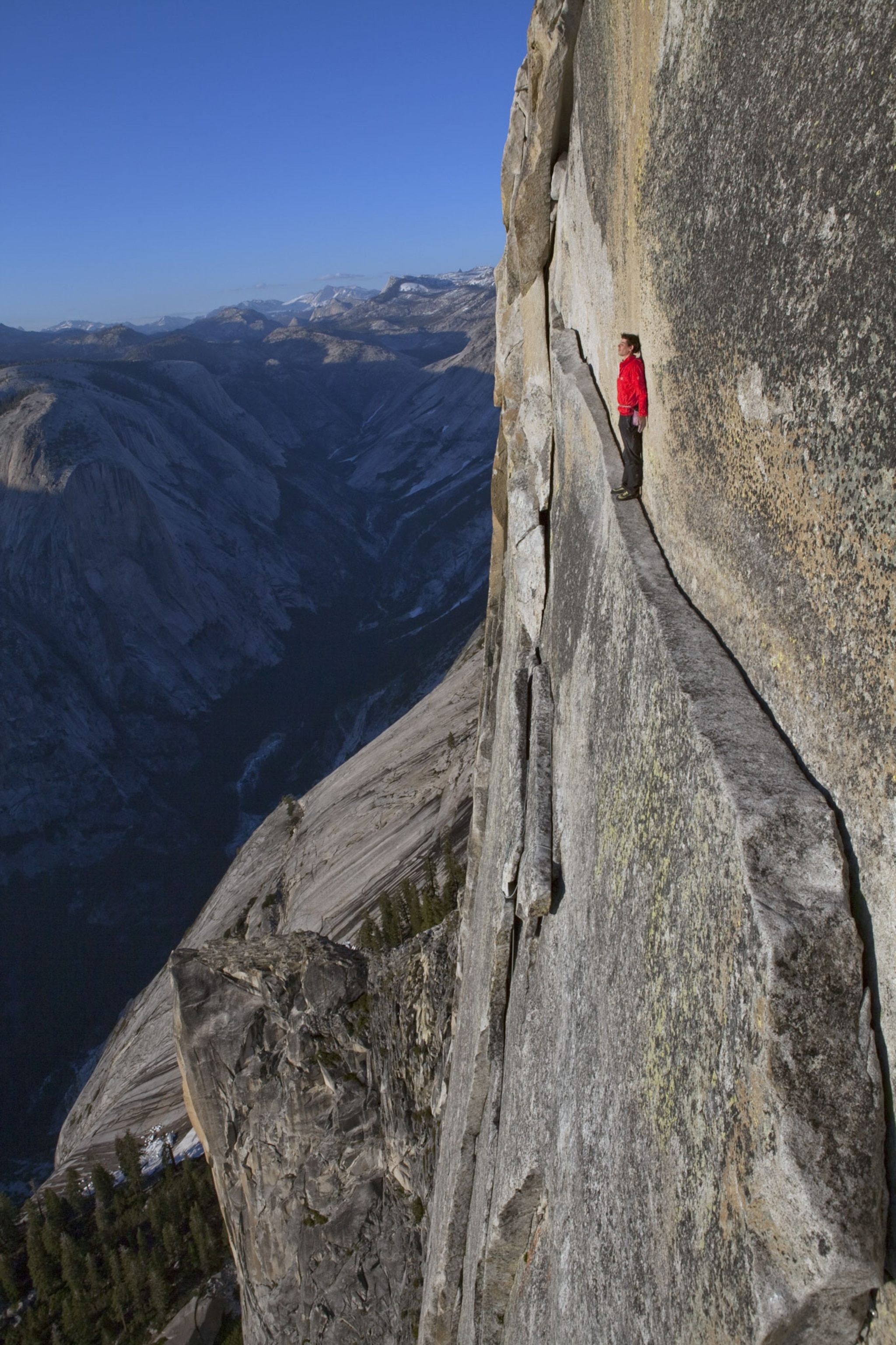 Alex Honnold walking along a ledge on Half Dome