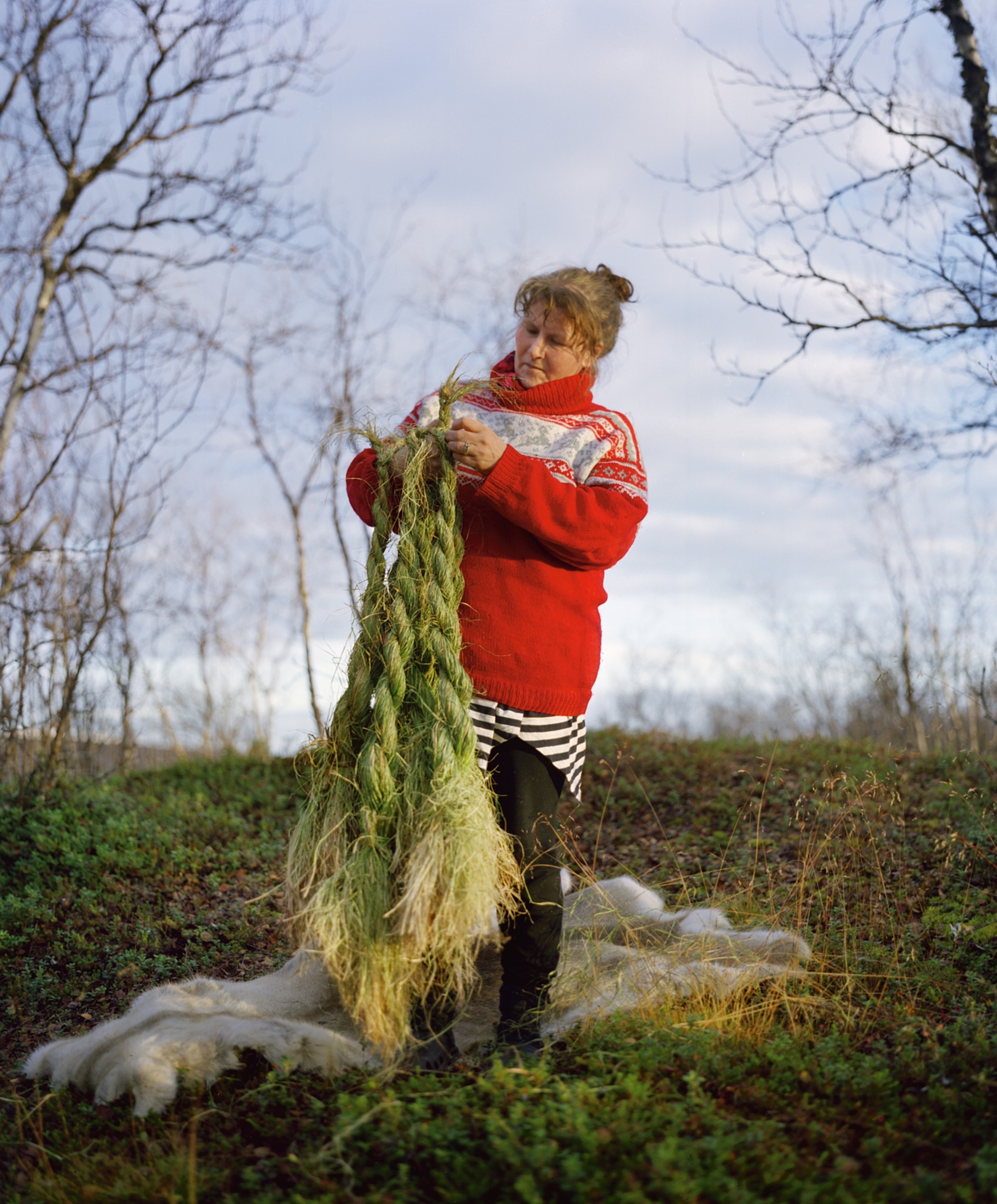 Ingrid Gaup braiding shoe grass she collected from river marshes