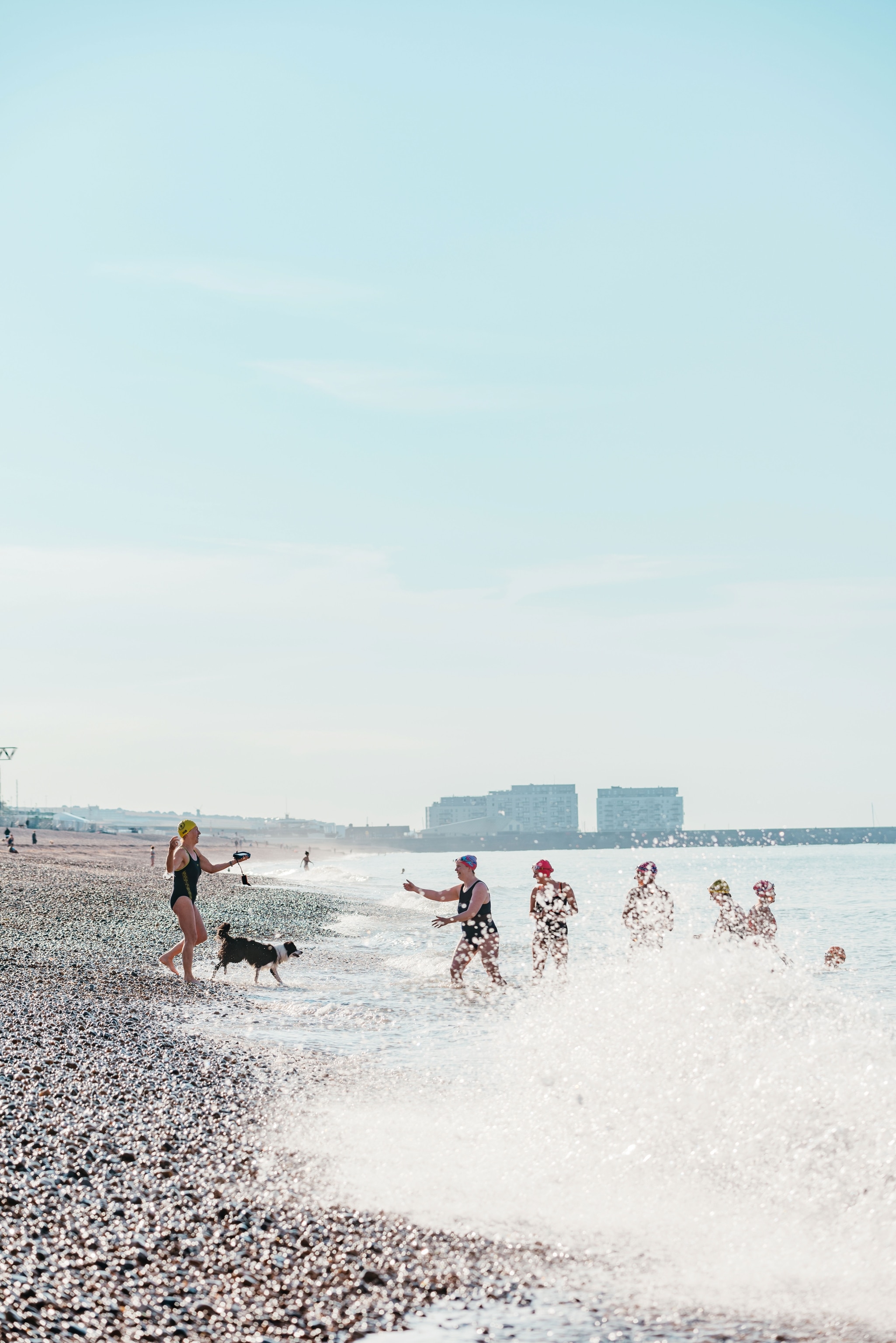 visitors near shore and in ocean on beach