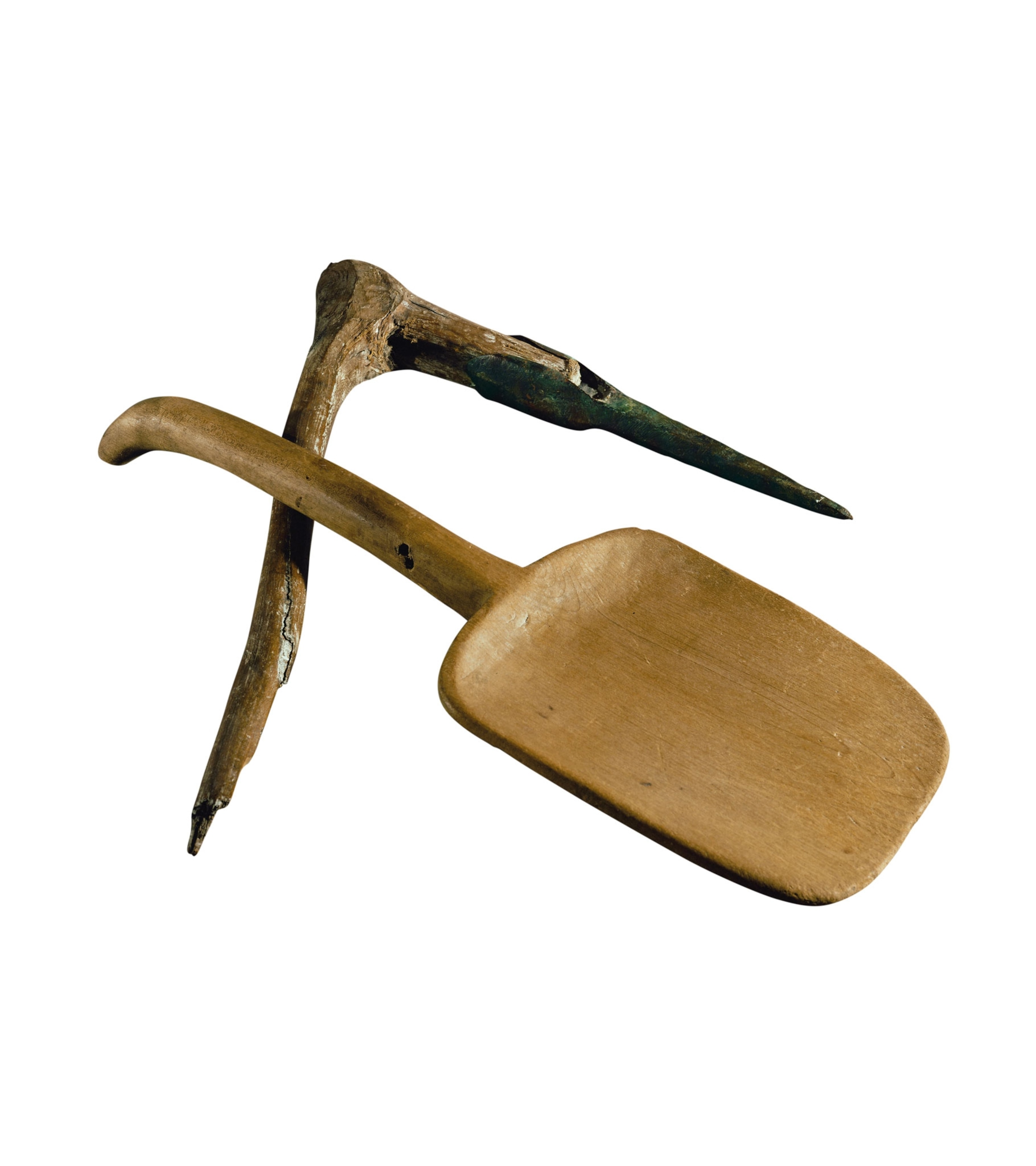 A wooden shovel and pick