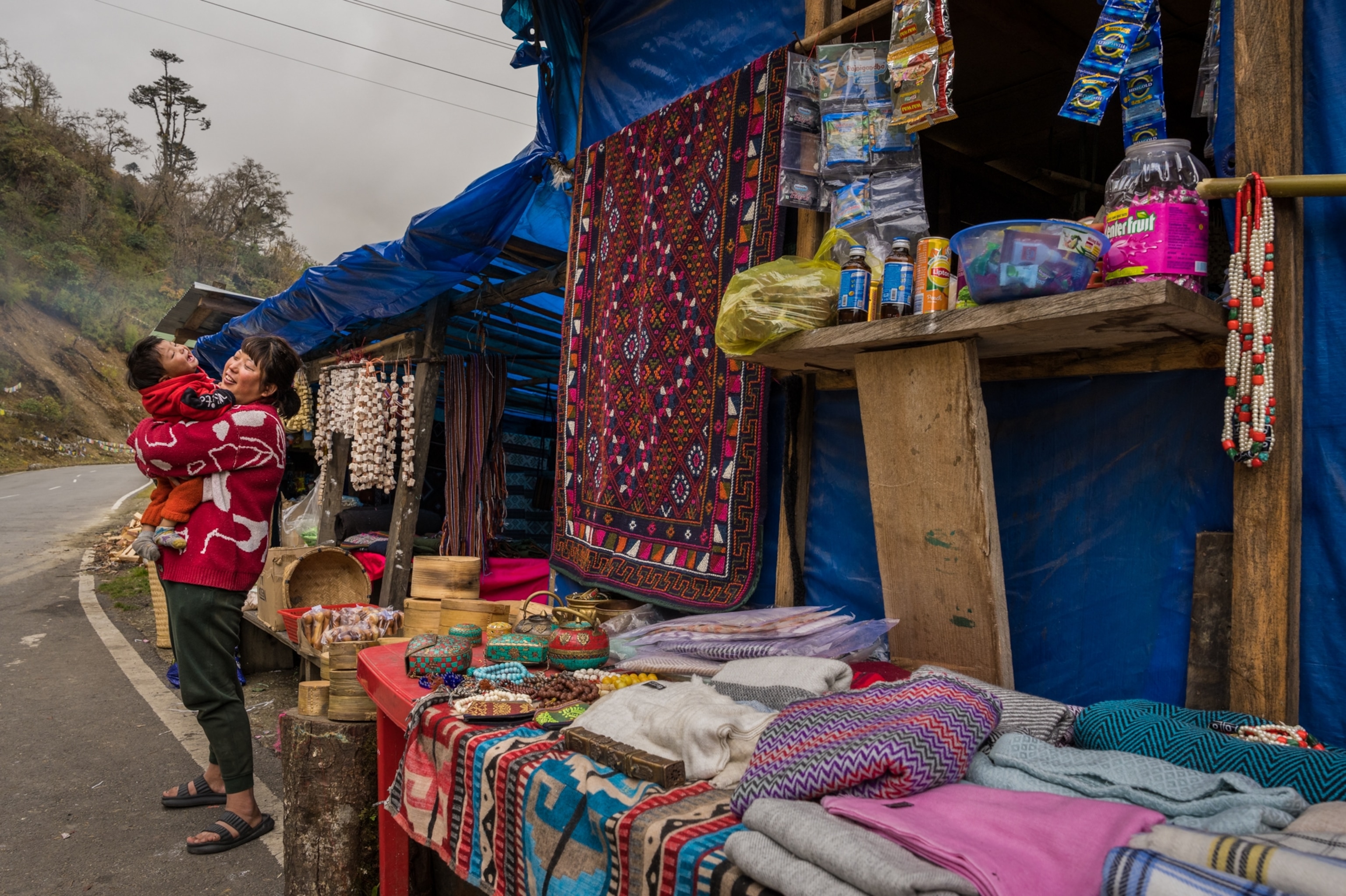 Stalls sell nomadic handicrafts at the Pele La (11,220 feet), the gateway to Central Bhutan.