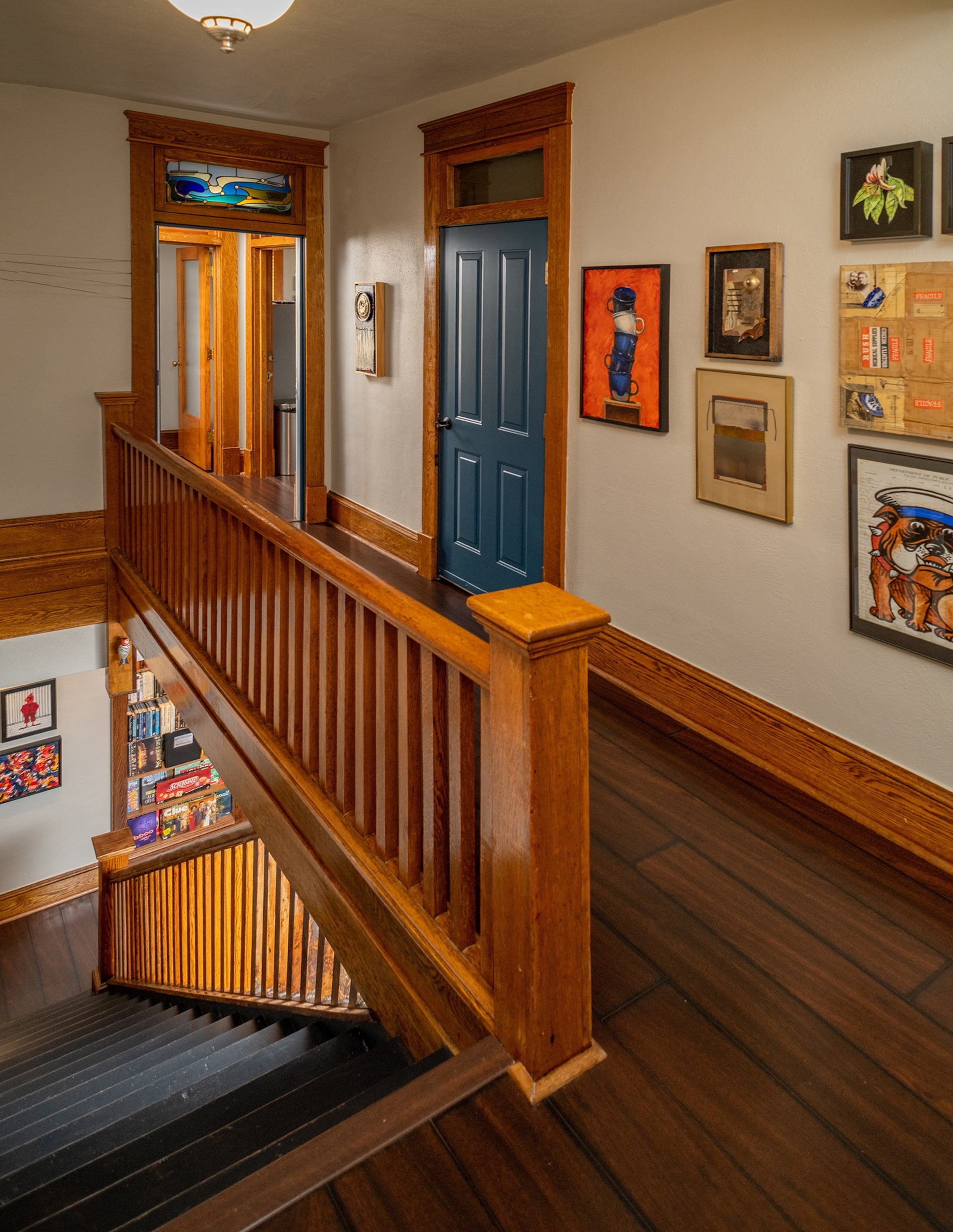 Stairwell and hallway with art at the Lafayette Flats in Fayetteville, WV.