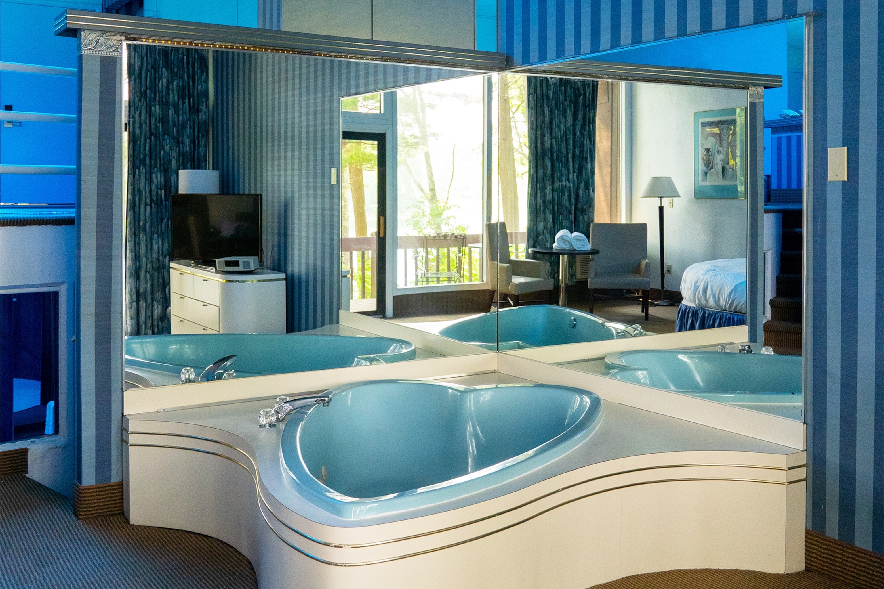 a heart-shaped bath tub in a motel
