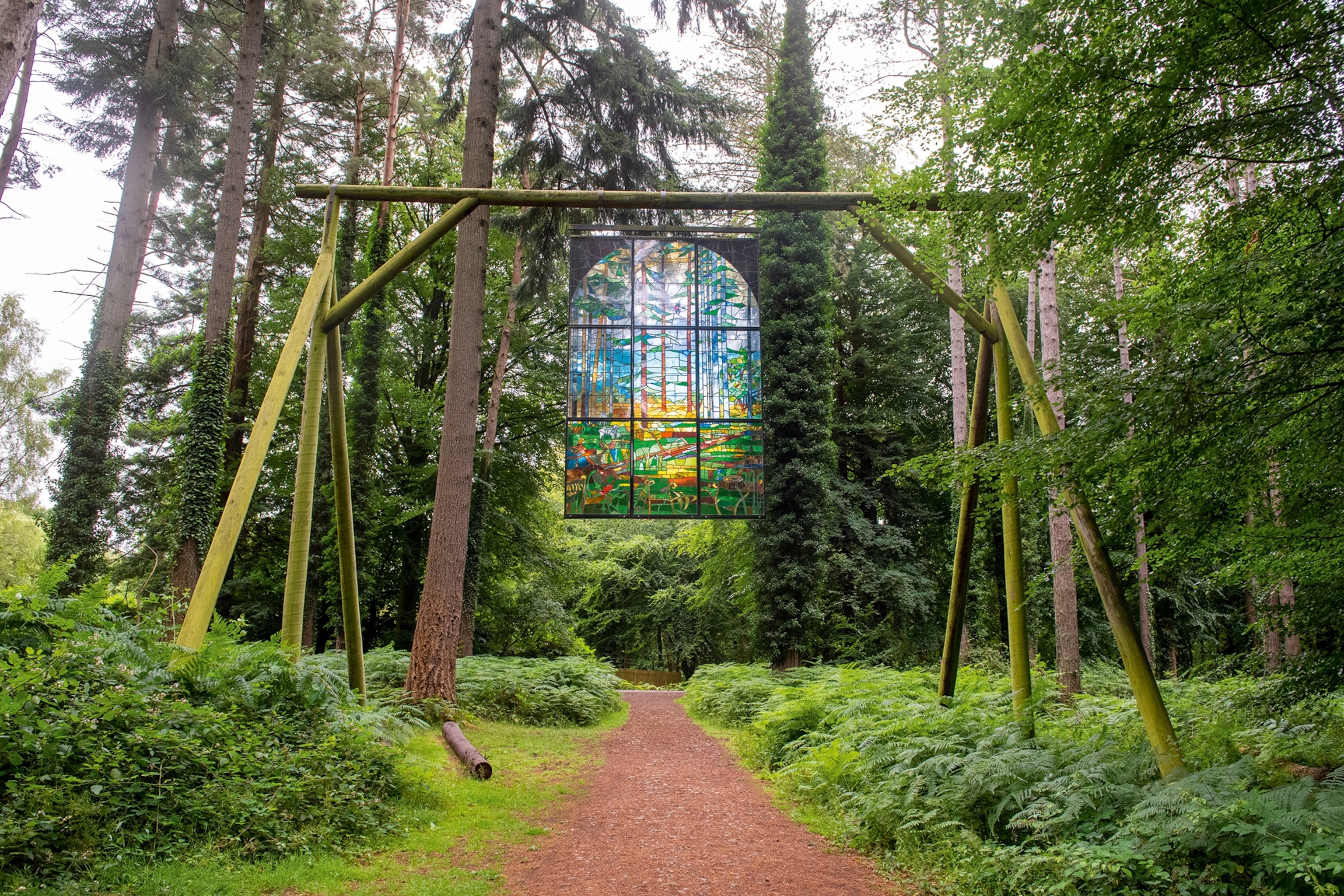 Stained glass window hanging in a forest