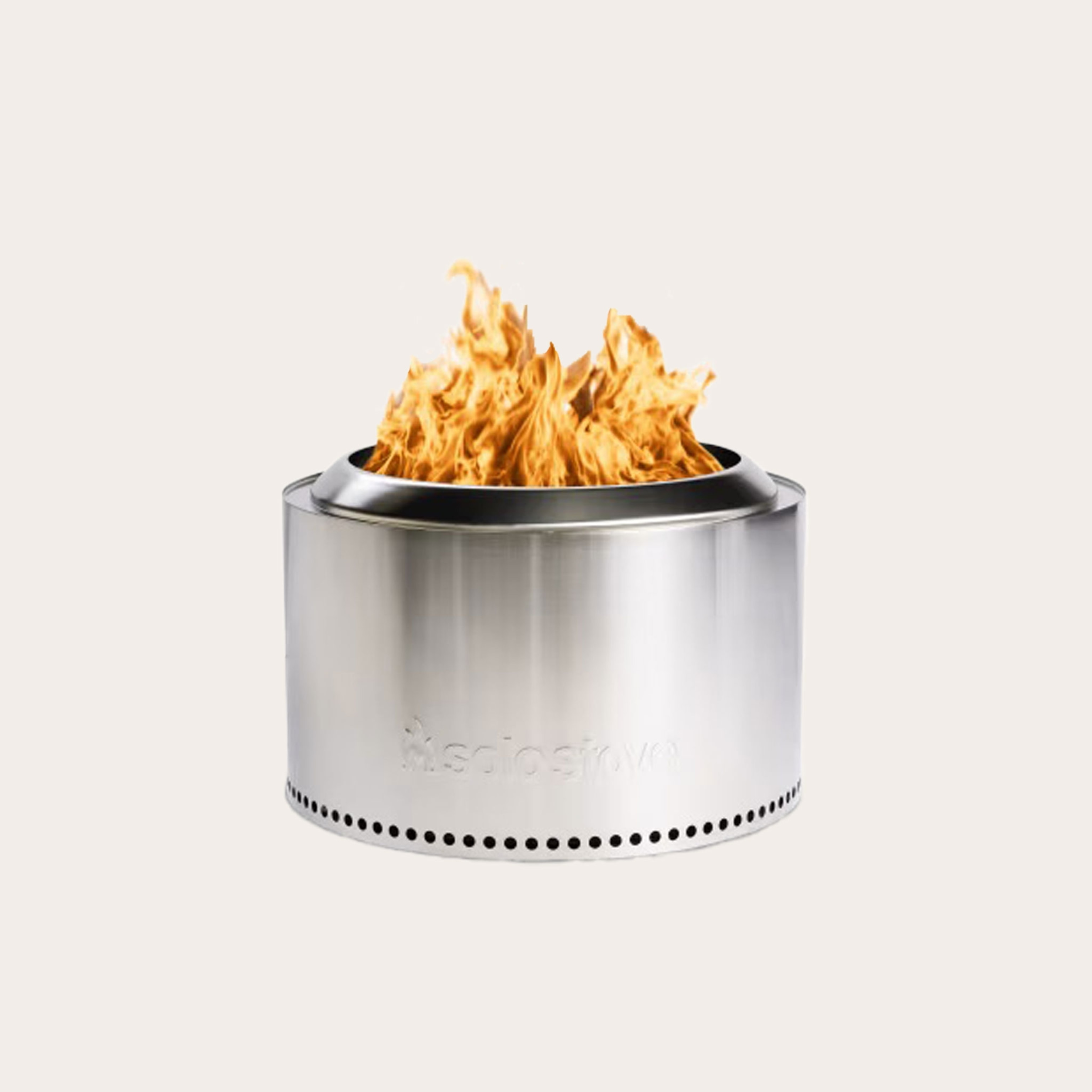 Silver round fire pit with flames placed on tan background.